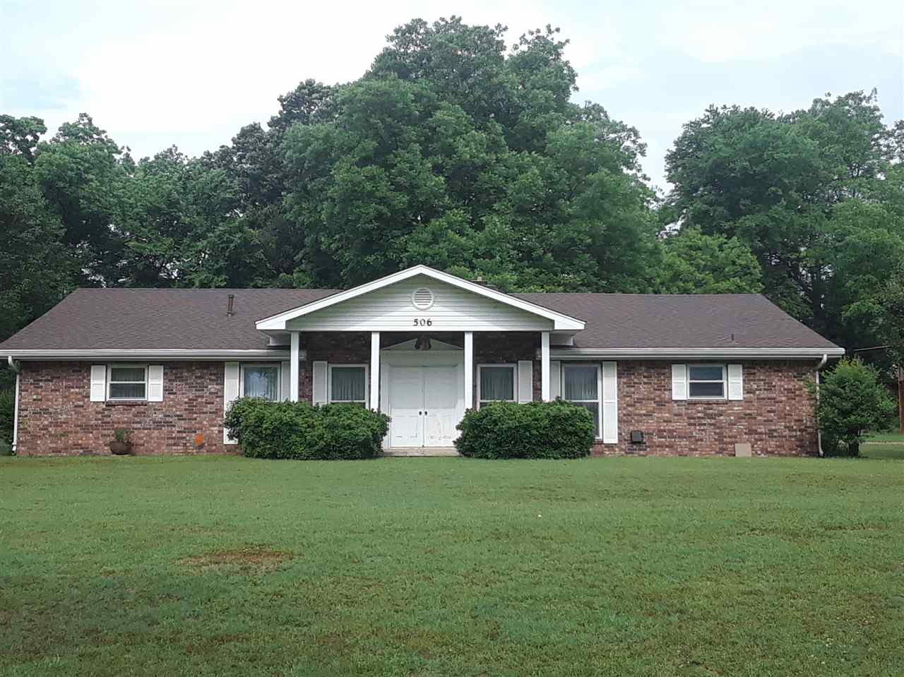Very well maintained large home located in a great neighborhood with 4 bedrooms, 2-1/2 full baths, brand new roof (2018), 2 HVACs replaced in 2013, LARGE kitchen (new appliances include wall oven, dishwasher, microwave), trash compactor, 2 water heaters, great room w/ fireplace, enclosed heated/cooled sun room, beautiful yard (almost an acre) with 2 storage bldgs in back, 2 car carport.  Selling AS IS.  Taxes include H/S Credit.