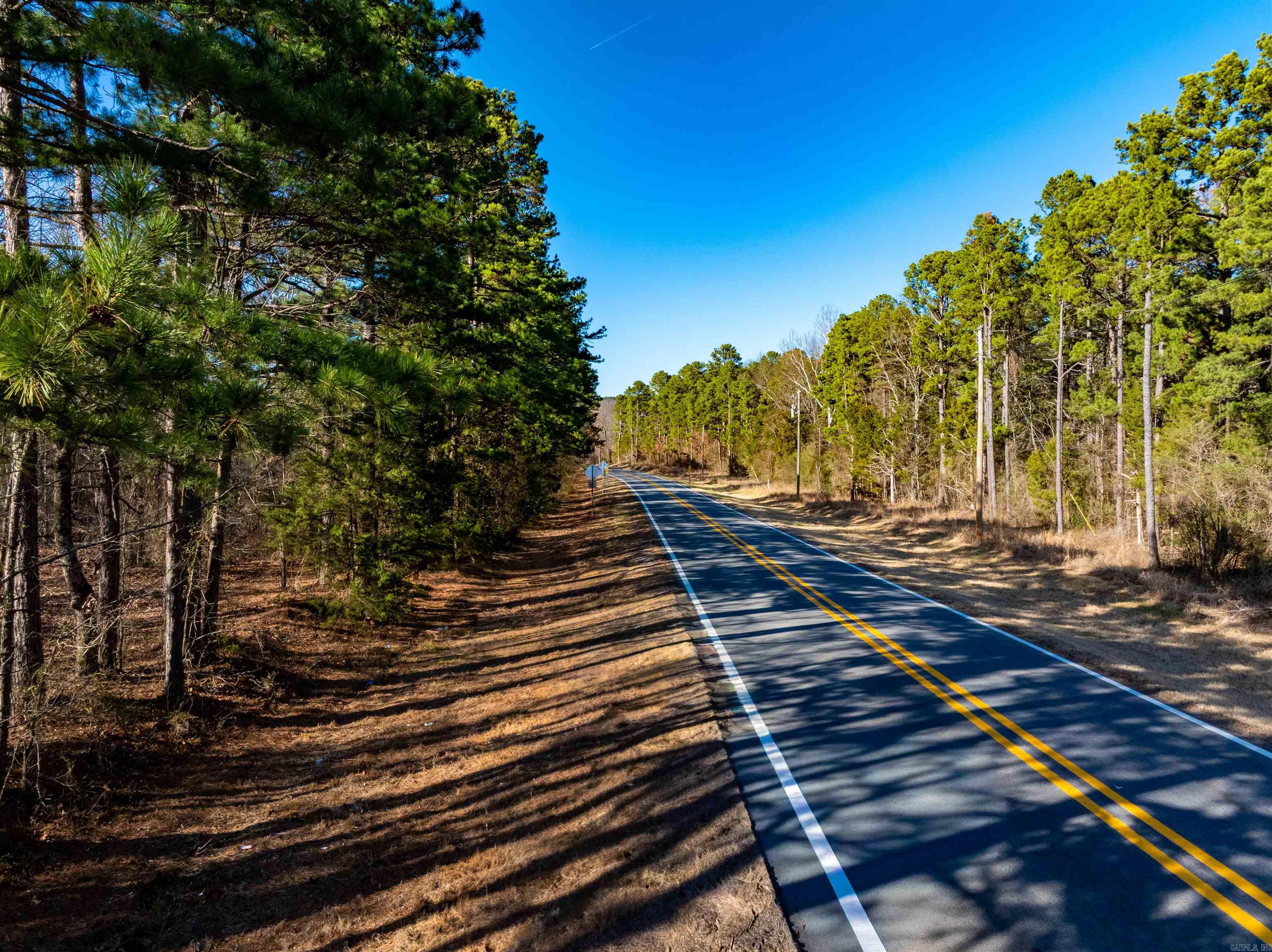 This rare offering includes 22 +/- wooded acres located on Edgemont Road in Cleburne County, featuring excellent highway frontage and easy access. The property is covered in mature timber, providing privacy, natural beauty, and multiple potential building sites. Whether you’re looking to clear a private homesite or create several build spots, this tract offers flexibility.  One of the most appealing aspects of this property is its location. While it offers highway visibility and convenience, it also backs up to a thriving subdivision, creating a unique blend of accessibility and privacy. Golf courses are nearby, and outdoor recreation is abundant. The property is also located close to Greers Ferry Lake, as well as the Middle Fork of the Little Red River and Devil’s Fork, where they flow into the lake—making this an excellent location for boating, fishing, and enjoying the outdoors. Finding acreage of this size with highway frontage, mature timber, nearby development, and proximity to Greers Ferry Lake is extremely rare. Whether you’ve been actively searching or just beginning to look!