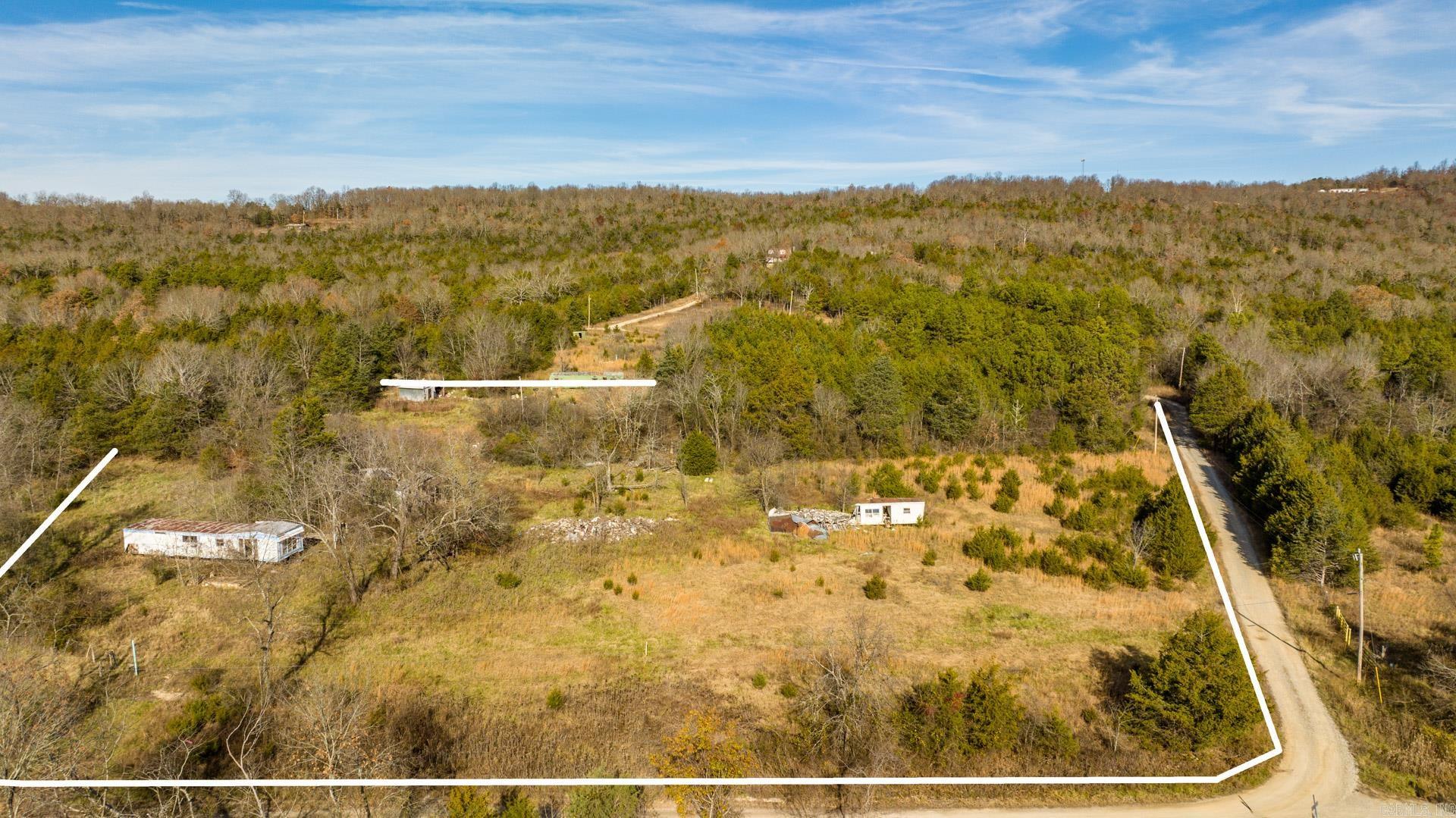 TRANQUILITY AT ITS FINEST! Get ready for the peace and quiet you've been dreaming of all while being 3 miles from downtown Yellville! This property has electric, well water, and a storm shelter on the property. The Buffalo National River is 15 miles from here along with other river access points. Survey on file. No seller property disclosure. There are 5 abandoned buildings on this property, so please be careful when walking around. There are 3 other lots available right around the corner, so be sure to check out Lot 16 (4.24 acres), Lot 17 (4.24 acres), and Lot 11 (5.99 acres).