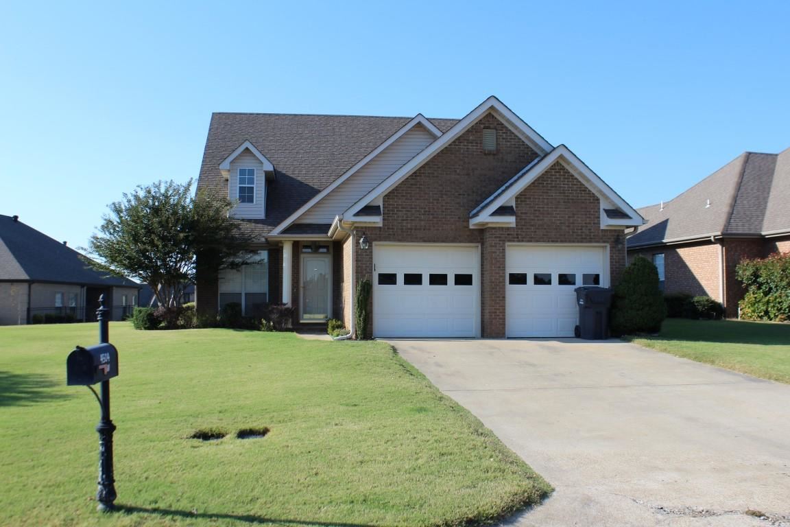 Beautiful three bedroom home on the 14th hole of golf course. Welcoming family room w/gas fireplace & neutral carpet. Spacious eat-in kitchen w/new granite counters, abundant cabinetry & tile floors. Main level master suite w/double vanity, corner jet tub, walk-in shower & French doors leading to a patio area overlooking the greens. Additional bedrooms upstairs share a Jack & Jill style bath. Other amenities include extensive landscaping, sprinkler system, two car garage, laundry room & covered patio.