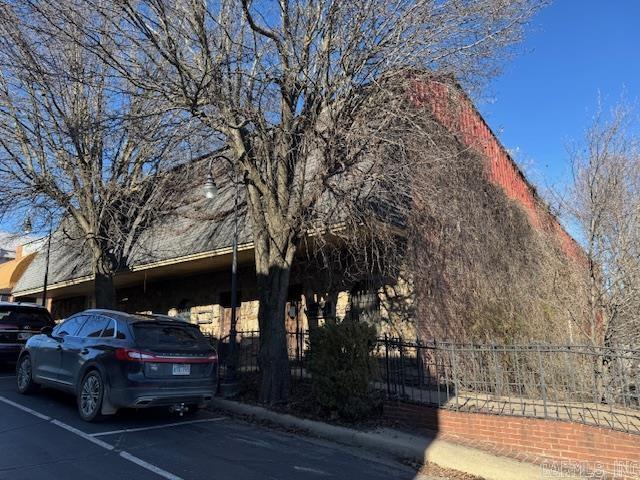 8000+ SQ FT OF OFFICE SPACE & HUGE PARKING LOT!  8115 square foot with approximately 15 offices, 1 full bath and 2 half baths. 3 entrances so it could be 3 different businesses but interior doors to each office area if needed for one big business. 2 central heat and air units in working order. Large basement storage area. Building does need some maintenance. Nice private parking lot joins building on the side. High visibility from US Highway 67N. Located on Everett Street just off Historic Pocahontas Court Square. Only $23 per square foot!