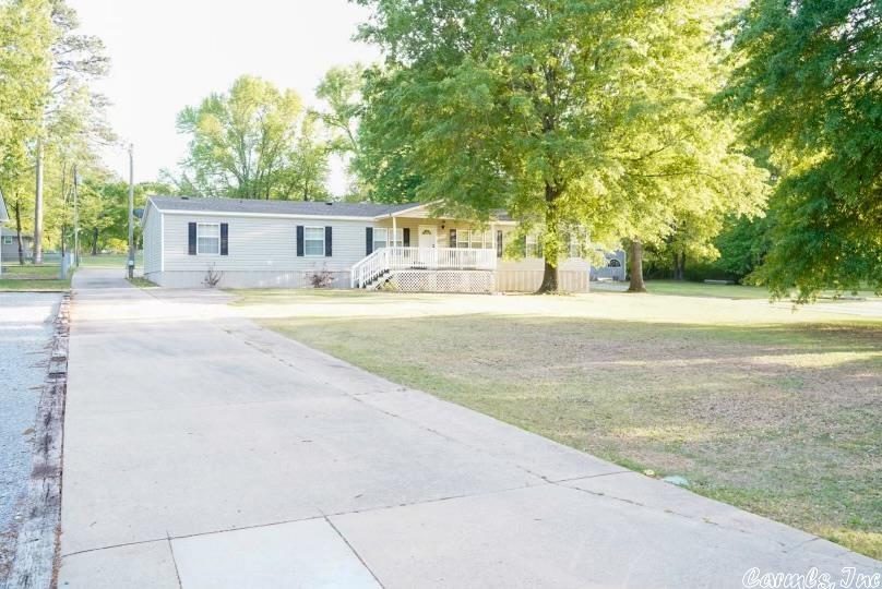 4 bed, 3 bath mobile home with detached 2 car garage and 20'x30' metal shop. This home has been well maintained and has new roof, less than 6 months old. Paved driveway in a quiet neighborhood with plenty of room on this .88 acre lot.