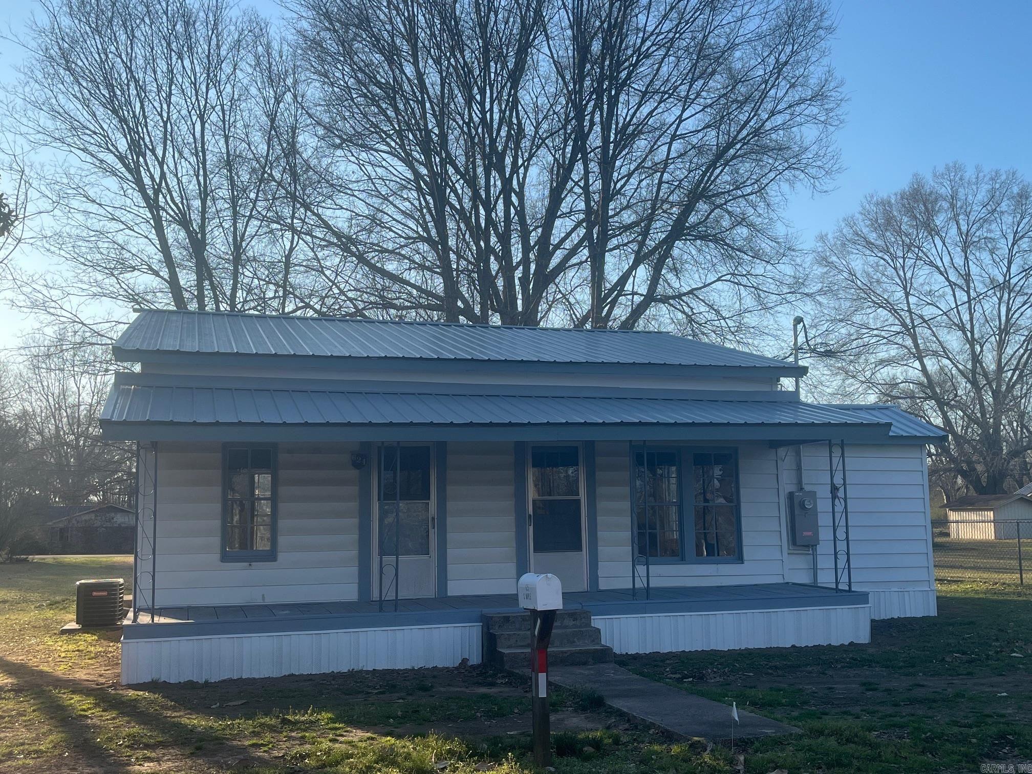 Totally remodeled. New metal roof, new CH/A, beautiful hickory floors, big windows & big open rooms. House can be purchased with front lot for $98,000 or both lots for $105,000.