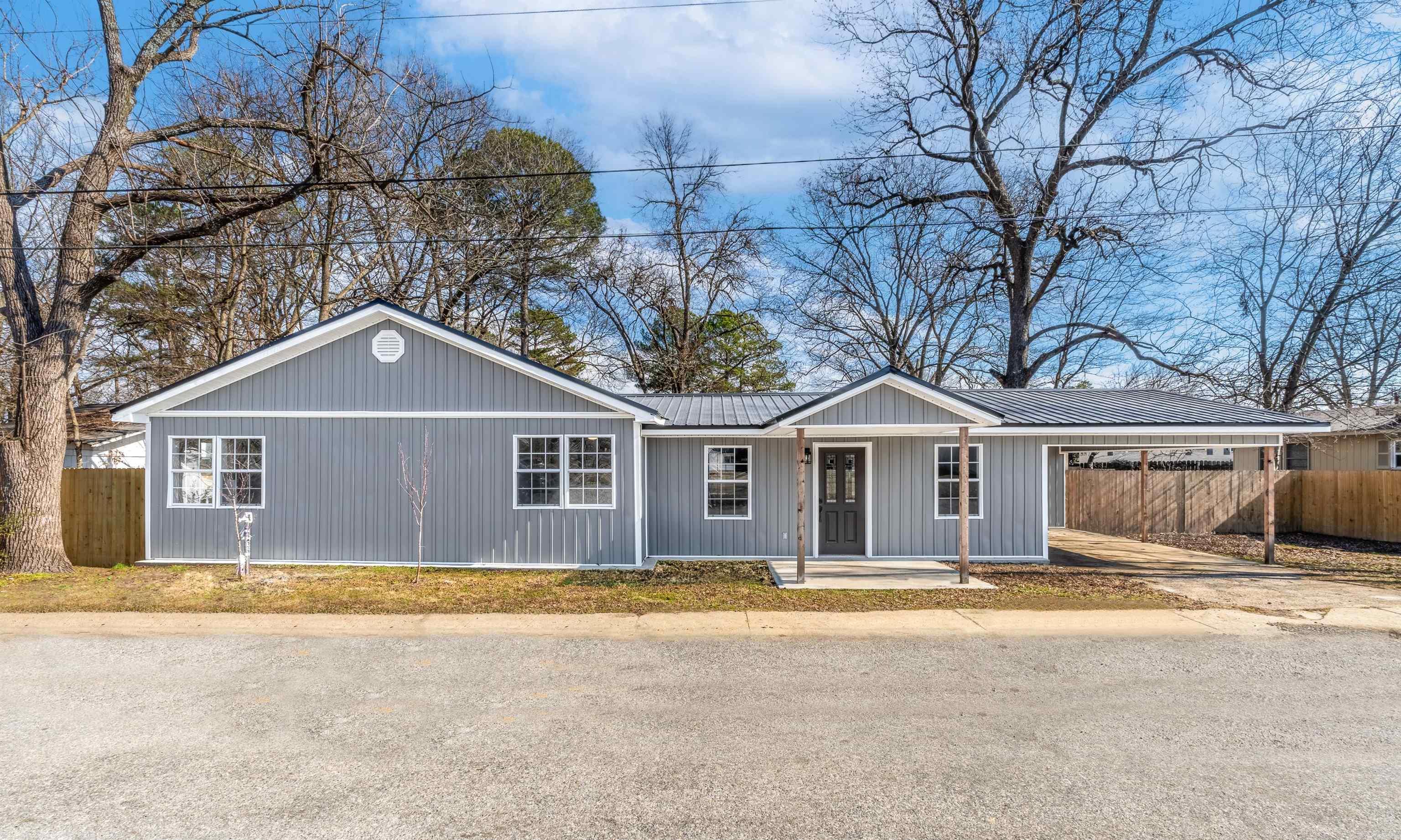 Step into this one-of-a-kind stunningly renovated home nestled in the heart of this quaint town. This home greets you with a gigantic living space as you walk in, and it only gets more enticing from that point forward! This open concept home is adorned with freshly installed light fixtures throughout every space, adding a touch of contemporary flair to every corner. The bathrooms have been totally transformed and both have farmhouse sink vanities. All closets offer generous space, ensuring ample room for storage and organization, and let's not forget the abundance of natural light streaming in through the newly installed windows, illuminating every room with warmth.  Embrace the abundance of space, both indoors and out, including a large fenced-in backyard offering privacy and endless possibilities for outdoor enjoyment.  Imagine playing a little game of kickball in the backyard with your family!  IT IS A DREAM HOME! Schedule your tour today!!!!  -Brand New 2023 HVAC with warranty -Brand New 2023 Metal Roof -Beautiful Backsplash -Brand New 2023 Hot Water Heater -All Brand-New Kitchen Appliances -Brand New Beams in LR -Brand New Siding -New Plumbing & SO much more!