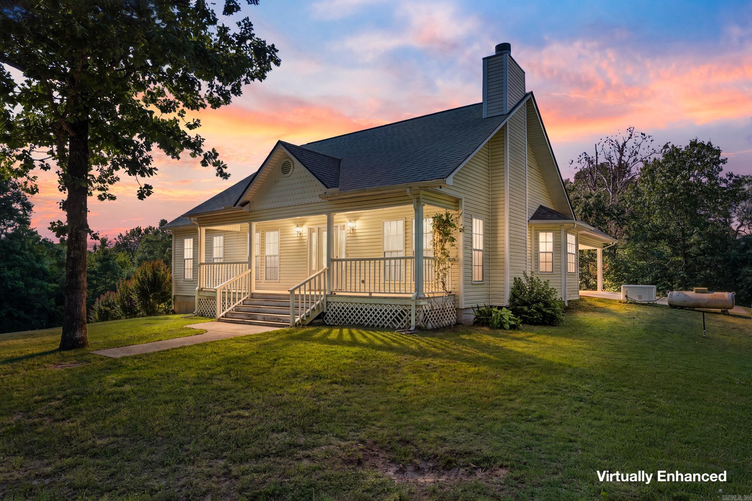 Nestled on 1.42 acres in the desirable Hand Cove area, this beautiful 4- bedroom, 3-bath country home offers the perfect blend of comfort, space, and convenience. Relax on the inviting covered front porch and enjoy the peaceful Ozarks setting. Inside, you’ll find an open floor plan with vaulted ceilings, creating a bright and spacious atmosphere ideal for everyday living and entertaining. The well-designed layout provides ample room for family and guests, while the finished walkout basement offers additional living space, a recreation area, or guest quarters. An attached 2-car carport provides convenient covered parking, and the generator offers added peace of mind year-round. Located just minutes from public access to Norfork Lake, this property is perfect for those who enjoy boating, fishing, and outdoor recreation. Experience country living with modern conveniences in a beautiful lakeside community.