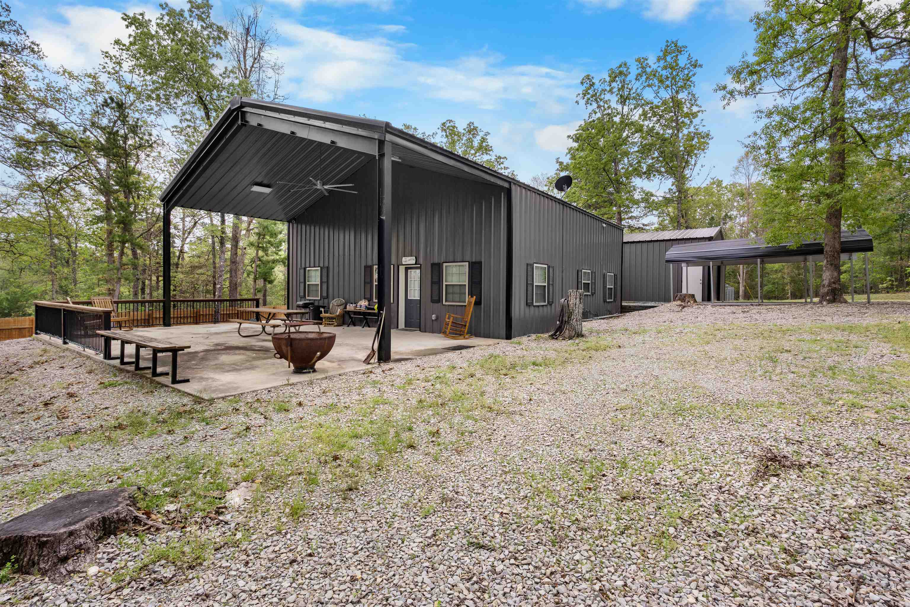 This spacious 4 bedroom, 2 bath cabin featuring an open floor plan with stunning vaulted wood ceilings, the main level includes a living area, kitchen, 2 bedrooms, a full bathroom, laundry room, and an office space. Upstairs, you’ll find a large private bedroom with its own balcony, a full bathroom, and a bunk room, perfect for guests or extra sleeping space! Step outside to enjoy a large patio area ideal for entertaining, along with a carport and a 24x24 shop for storage or hobbies. Located within walking distance to Lake Norfork and a public boat launch, this property is perfect for lake lovers, weekend getaways, or a full-time home.