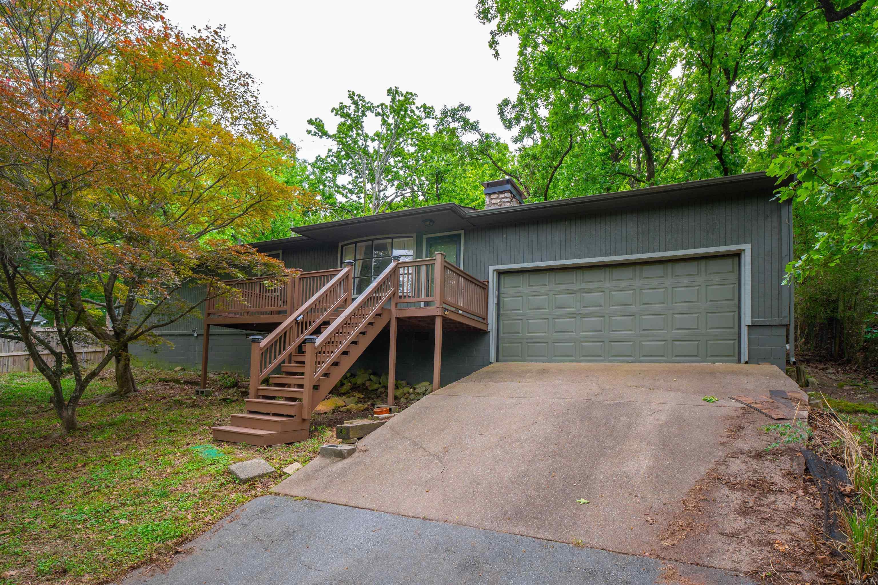 Tucked away on nearly a full acre of land, this treehouse-inspired retreat offers the perfect blend of privacy, charm, and character. Surrounded by mature trees, the property feels like a peaceful escape from the everyday. The kitchen is equipped with all new stainless steel appliances (2023)  The home itself welcomes you with warm, inviting textures and a cozy, cabin-like atmosphere. At the heart of the living space, a stunning large gas log fireplace creates a natural gathering place.   Outside, the expansive .99-acre lot provides ample room to roam, garden, or simply unwind.   Whether you're searching for a peaceful starter home or a unique retreat with character, this property delivers a rare opportunity to live immersed in nature without sacrificing comfort. Rustic, serene, and full of potential, this hidden gem is ready for you to call home.