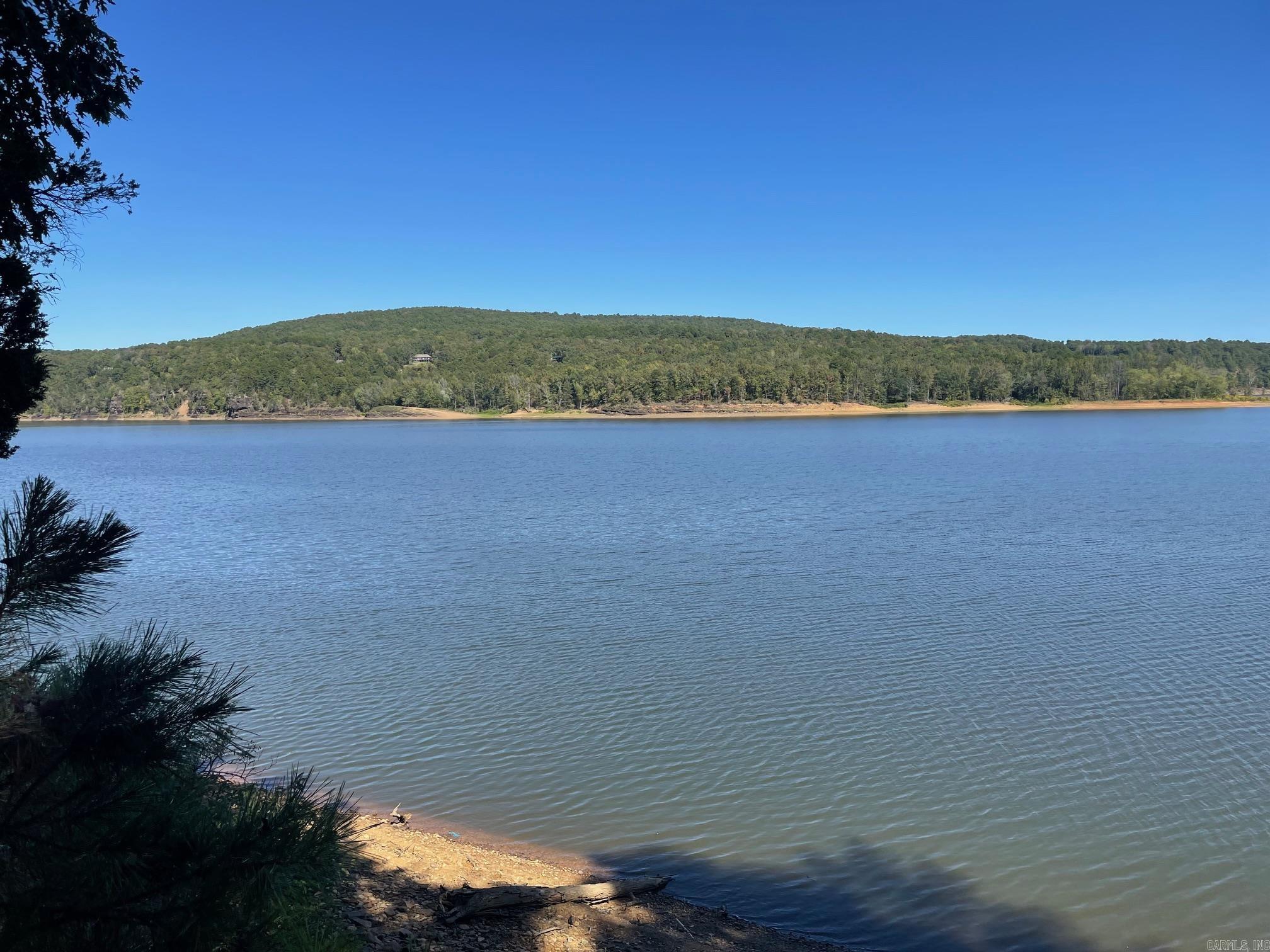 Discover your perfect getaway on Greers Ferry Lake!  This lakefront lot, priced at just $69,900., offers stunning views and direct access to one of Arkansas's most sought-after lakes.  Imagine waking up to peaceful water views, spending your days boating, fishing, or swimming right from your own property.  The lot provides an ideal setting for a vacation home, retirement retreat, or year-round residence.  With utilities at the road and easy access to local marinas, shops, and restaurants, you'll enjoy both tranquility and convenience.  Opportunities like this don't come often- build your dream lake house today and start making memories on the shores of Greers Ferry Lake!