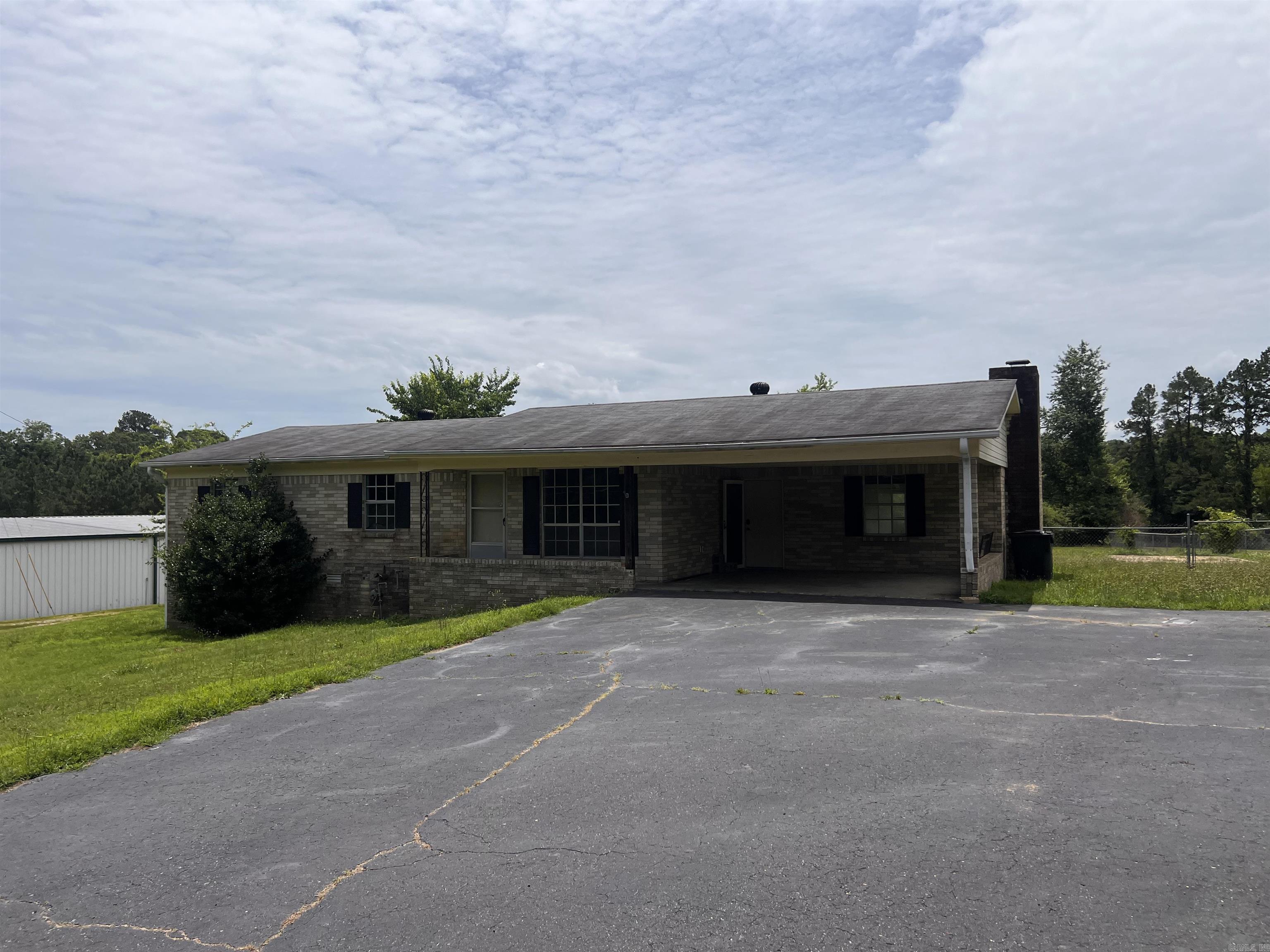 Every now and then, a home comes along that's a lot like an old classic song—you hear it and know it's still got all the right notes. It may need a little polishing, but the beauty was never gone. Welcome to 2950 Spring Street, a 3-bedroom, 2-bath home on .78 acres that's spent the last decade faithfully serving as a long-term rental since 2015. Like anyone who's worked hard for years, it's earned a little refresh—but the good news is, the transformation here is mostly cosmetic. This isn't a tear-down. It isn't a "start from scratch" project. It's a home waiting for someone to bring back its sparkle. Think of it as the house equivalent of finally scheduling that makeover after years of putting everyone else first. The structure is here. The space is here. The location is here. Now it's ready for its next chapter. Nestled in a convenient Hot Springs location near schools and with quick access to the bypass, this property offers the kind of practical advantages buyers love, paired with nearly ¾ of an acre to enjoy, expand, garden, play, or simply stretch out. A little paint. A little vision. A little love. And before long, 2950 Spring Street could be shining again.