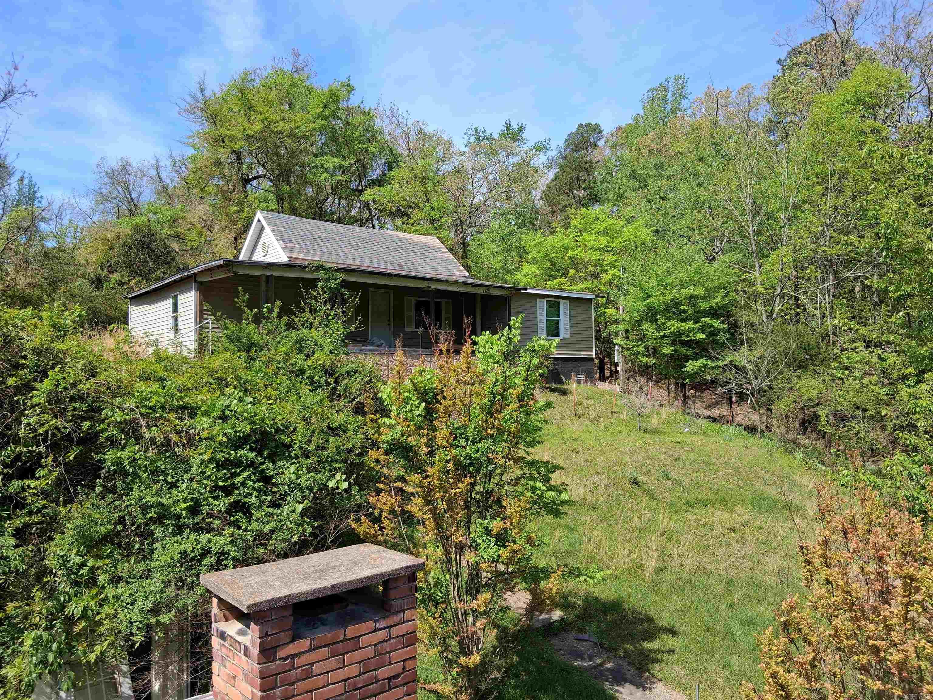 Investment property which means AS-IS. Some rehab work has been done. All building materials will be left to help new owner with rehab. Seller is only responsible for his tools that are in the garage. Beautiful view from the front porch on top of the hill. Minutes from downtown, hiking trails and stores. If purchased with property 419 Holly St. total list price is 130k. 419 Holley St. is listed for 65K