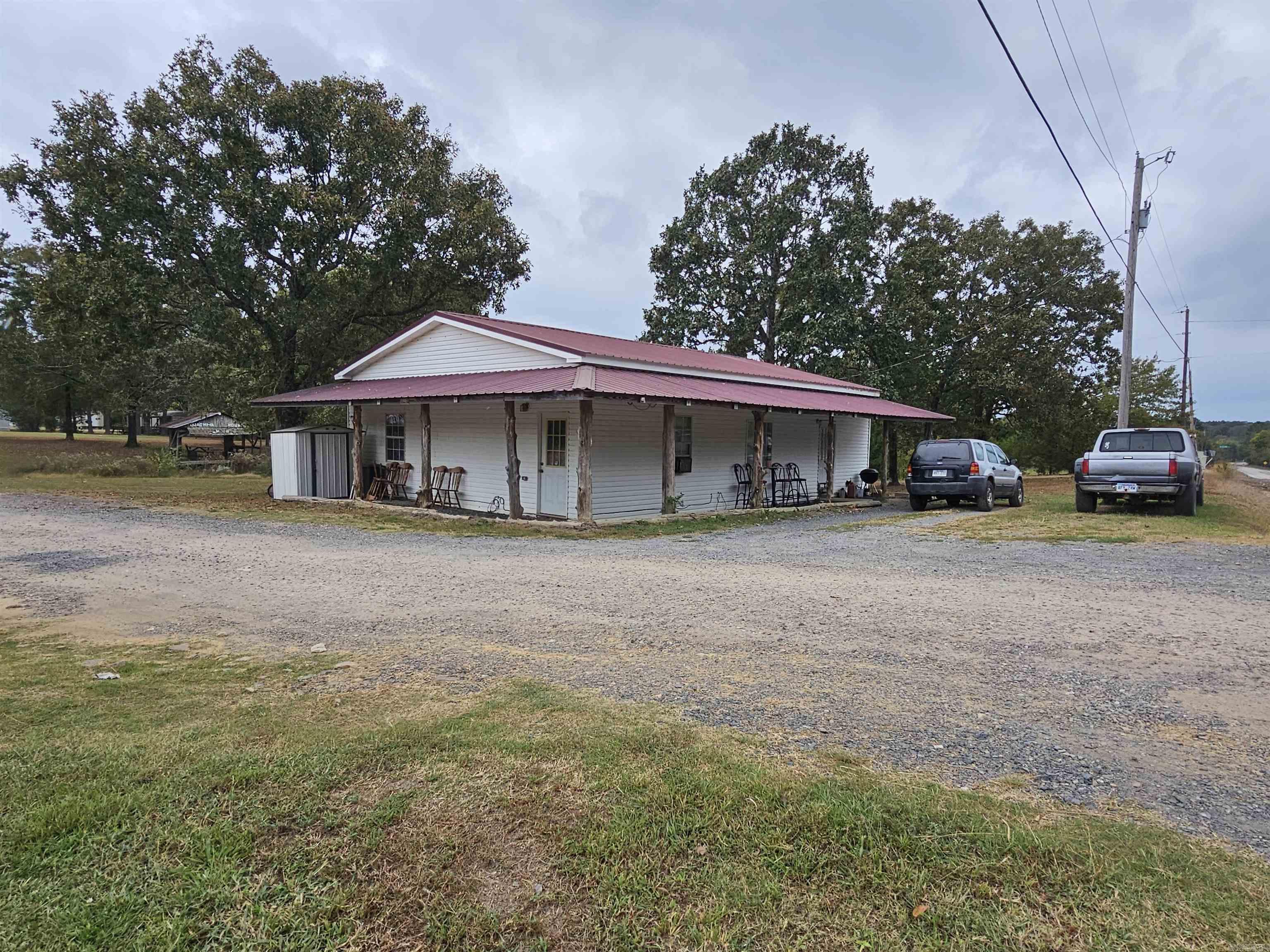 Mobile Home Park Investment Opportunity: Welcome to a prime investment opportunity with this mobile home park containing 20 mobile homes, 3 bed 2 bath frame home, 2 bed 1 bath frame home, 2 tiny homes, 8 outbuildings (3 containing a surplus of materials and appliances), sprawling across a generous 7.6 acre lot located just outside the city limits. This park presents a golden chance to add significant value and growth potential. With ample space to expand and add more units, investors can capitalize on the increasing demand for affordable housing. All homes are park owned (with the exception of 1 RV), with tenants responsible for paying their own utilities (with the exception of some that the park pays the water). Conveniently located close to shopping centers, entertainment venues, ATV trails and the proposed bike trails (that are located within 5 minutes). This mobile home park ensures easy access to essential amenities and leisure activities making it a desirable location for residents. See Agent Remarks