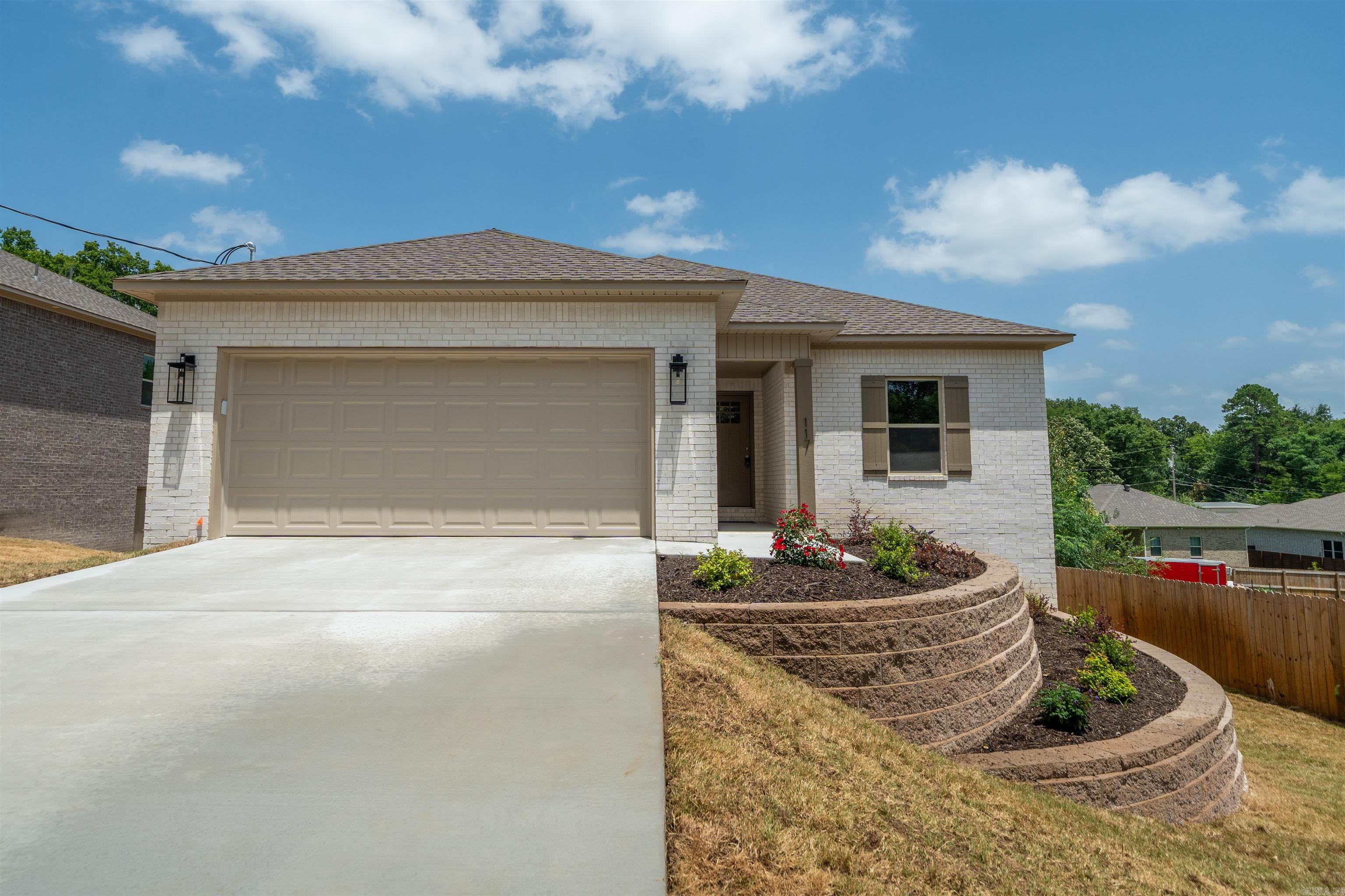 Discover quality craftsmanship and modern comfort in this beautiful new construction home featuring 3 bedrooms, 2 bathrooms, and 1,427 square feet of thoughtfully designed living space. Conveniently located near shopping, dining, schools, and everyday amenities, this all-electric home offers an open-concept floor plan with premium Shaw Luxury Vinyl Plank flooring throughout. The stylish kitchen features quartz countertops, abundant cabinetry, and flows seamlessly into the spacious living and dining areas. The private primary suite includes a walk-in closet and beautifully appointed walk-in shower, while added insulation between rooms enhances privacy and comfort. Built for efficiency and low maintenance, the home includes central heat and air, an insulated garage door and insulated garage walls, fiberglass exterior doors, brick exterior, vinyl soffits, and a crawlspace foundation. An irrigation system on a separate meter helps reduce water costs while keeping the lawn looking its best. Move-in ready and built with quality in mind, this is an exceptional opportunity to own a brand-new home in a highly desirable location.