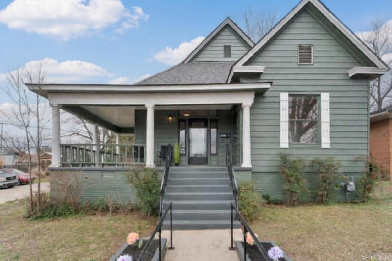 Discover timeless charm in this meticulously remodeled 1940’s Craftsman home—a perfect blend of vintage appeal and modern updates in the heart of Little Rock! Relax on the spacious front porch with morning coffee or summer BBQs. Inside, tall ceilings, refinished original hardwood floors, and abundant windows fill the space with natural light and warmth.  The flexible layout flows seamlessly: front guest bedroom/office, generous living room for any furniture setup, versatile formal dining (ideal as primary suite alternative), front guest bath for convenience, and private bath toward the back. Enjoy extra storage in the separate laundry room plus another guest bedroom/office for endless options. The spacious kitchen delights with ample cabinets, granite countertops, farmhouse sink, and room for a cozy breakfast nook.  Private backyard parking includes covered parking pad. Major recent updates: new floors, roof, HVAC, kitchen, bathrooms—truly move-in ready! Prime spot minutes from UAMS, Children’s Hospital, and Downtown Little Rock.