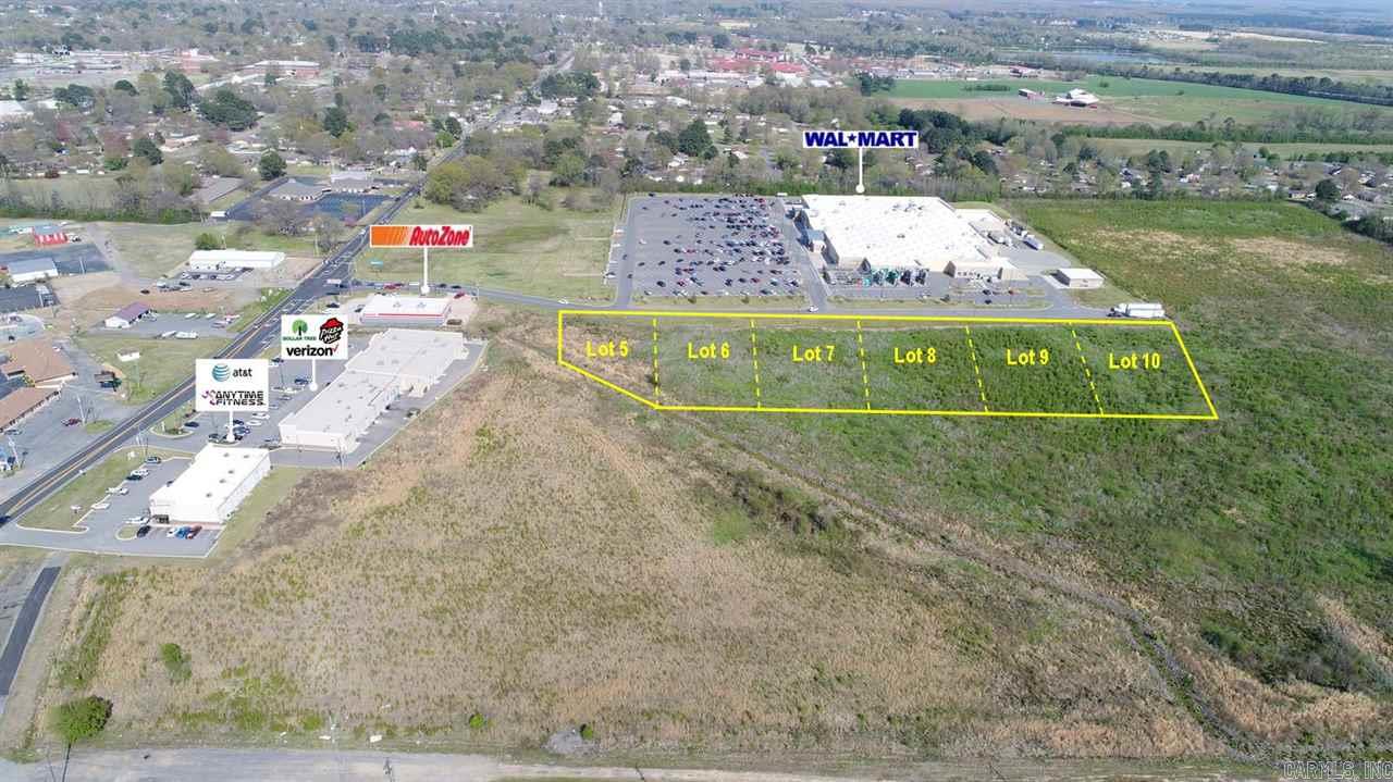 Prime Commercial Lot! Out-parcel to Walmart Supercenter located on W. Center Street. Approx. 150' frontage. Site is level & cleared w/city utilities available. Zoned C-2.  Owner will re-divide according to Buyers needs. Excellent location for retail, office, or any general commercial use.  Additional adjacent lots and acreage available. Some use restrictions may apply. Call for more information.