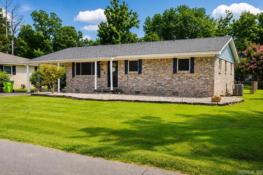 Move-in ready home situated on a level lot with a fully fenced backyard, this well-maintained home features a brick and vinyl exterior, a screened-in porch and a deck perfect for relaxing or entertaining.  The backyard also includes a storage shed and an in-ground storm shelter.  Inside, you'll find laminate flooring throughout the main living areas and carpet in the bedrooms, newer windows and cabinetry in the kitchen.  Major updates include a new roof (2023), new AC (2024) new plumbing underneath the home, and a water heater (2019).  A wonderful opportunity to own a home with great outdoor space and valuable updates already completed!