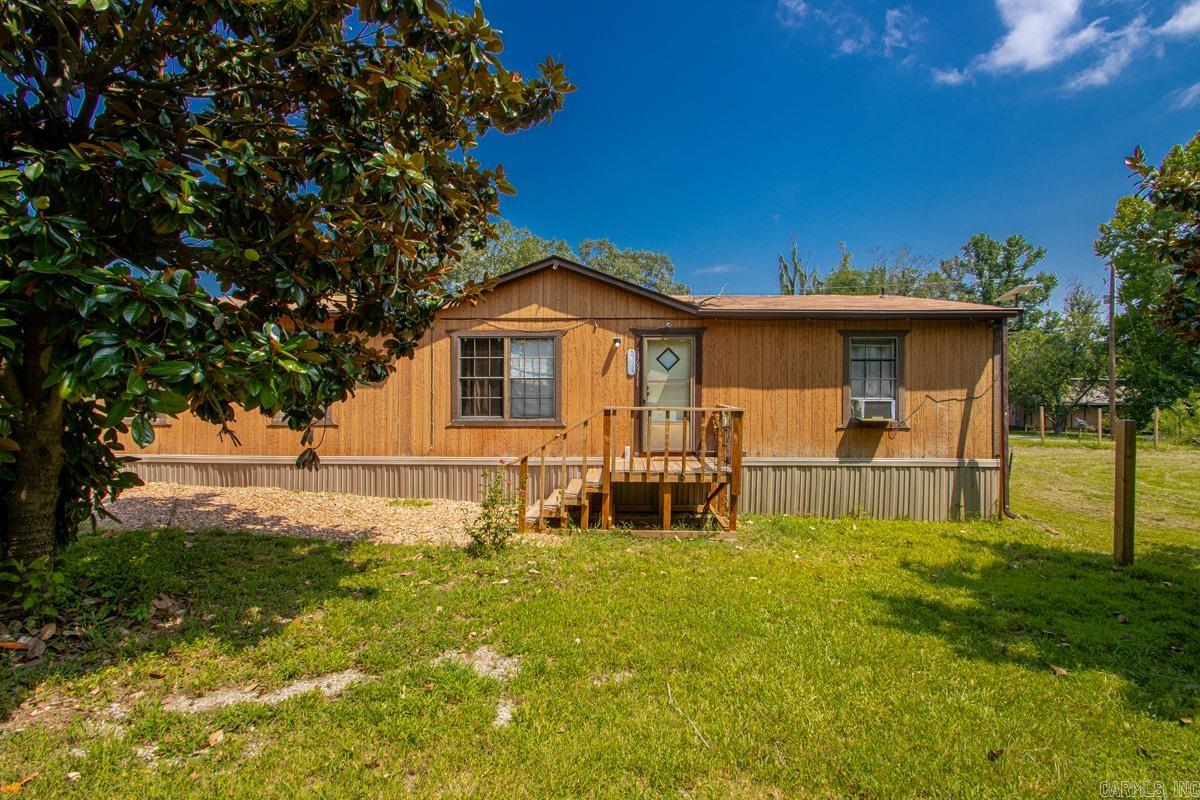Welcome home to this charming 3-bedroom, 2-bath farmhouse-inspired retreat, perfectly situated on a beautifully maintained, level 1-acre lot. Filled with abundant natural light, this cozy home features durable luxury vinyl plank flooring throughout the main living areas, creating a seamless blend of style and functionality.  Every inch of this property has been meticulously cared for, making it truly move-in ready. Outside, you'll find two spacious storage sheds, providing plenty of room for tools, hobbies, or extra storage. With its peaceful setting, thoughtful updates, and immaculate condition, this property offers the perfect balance of country charm and everyday comfort.