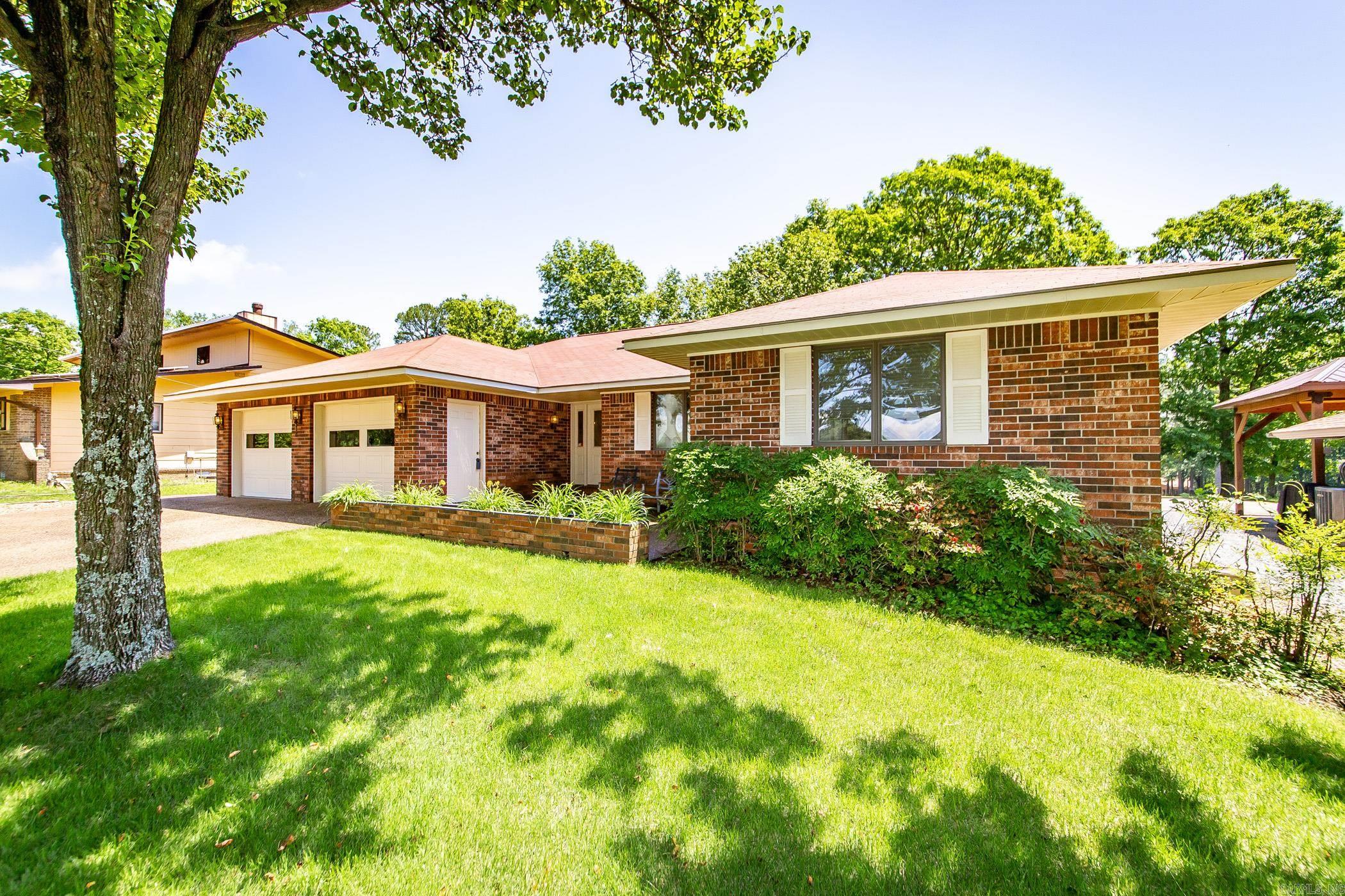 In the prestigious Indian Hills area on the 10th green, this lovely home offers a blend of comfort and luxury. Perfect for those who appreciate golf course living and an active lifestyle. Plenty of room for entertaining w/ an open feel that joins the kitchen, lg dining room, den and LR. Interior features are too many to count including: kitchen w/ Corian countertops, prep sink/wet bar, island w/ built-in wine rack, kitchen cabinets galore, two ovens, a microwave and trash compactor. Den boasts plenty of room for low-key get-togethers. Lg master bdm has a roomy WIC and ensuite w/ a double vanity, lg jetted tub and separate shower. Guest room w/ ensuite has a lg soaking tub and separate shower. 3rd bdm and ¾ bath w/ lg walk-in shower provide addt’l comforts. Laundry room w/ washer/dryer that can convey. New water heater and Anderson windows makes this home a win. Exterior Features: roomy two-car garage w/ 2 doors, storage room, golf car/utv/atv garage and 2 new openers. Lush Zoysia lawn w/ sprinkler system. Lg 15x30 rear back patio w/ access from the den for easy entertainment flow.  Seller will pay $2500 of buyer’s closing costs. $1,000 bonus to buyer’s agent at closing.