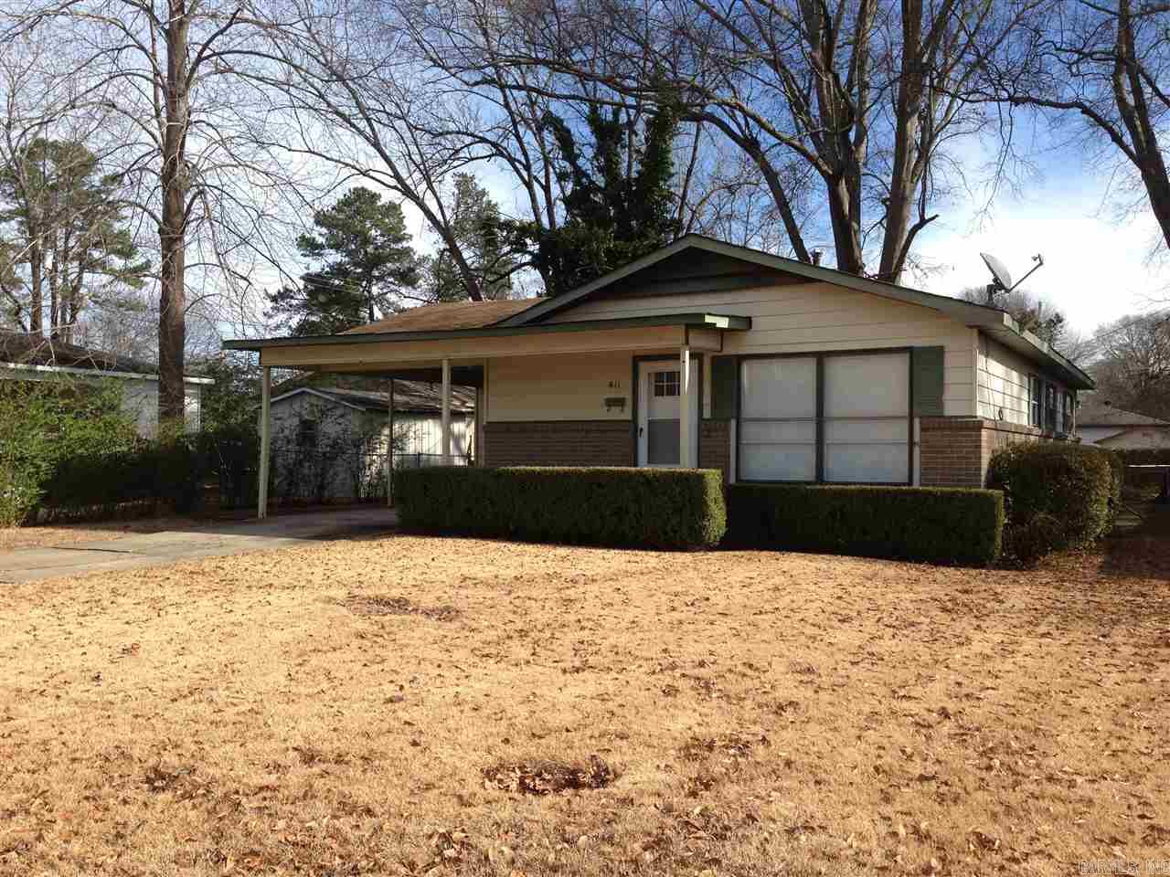 This house is move-in ready!  Original hardwood floors in den and bedrooms and new vinyl tiles in wet areas.  Lots and lots of new stuff:  lights and fans - kitchen cabinets - blinds - front door - gas stove & dishwasher (newer) - disposal & sink -  bathroom has new commode and sink - granite on the kitchen island and counters.   This home has an open floor plan also.  There is a nice storage area off of the carport as well as area for the water heater.  Close to Caldwell Elementary.
