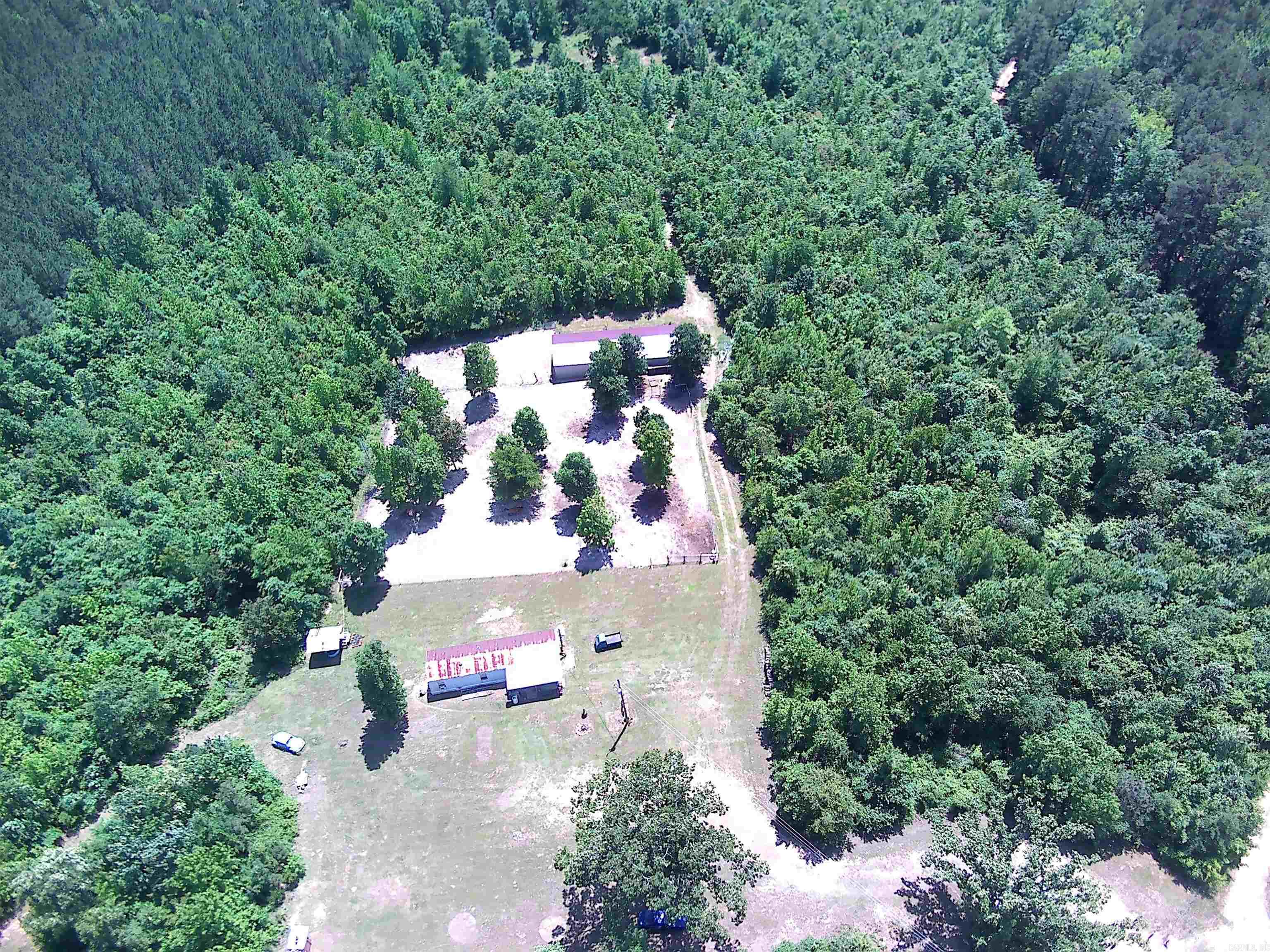 ***7.78 Acres with Mobile Home & New 24x70 Shop Building on Scenic Skyline Drive*** Beautiful property with multiple locations to build a new home, cabin or hunting retreat. The interior of the mobile home has been updated and is super cute and cozy with a spacious kitchen/living area. For hunters, there is a covered area with water and electricity for cleaning game as well as "shooting lanes" and multiple places for deer stands. The new 24x70 metal building has overhead doors on each side for pull through convenience and could store all of your toys and equipment. High speed fiber internet by South Central Co-op lets you stay connected while also enjoying the country life!