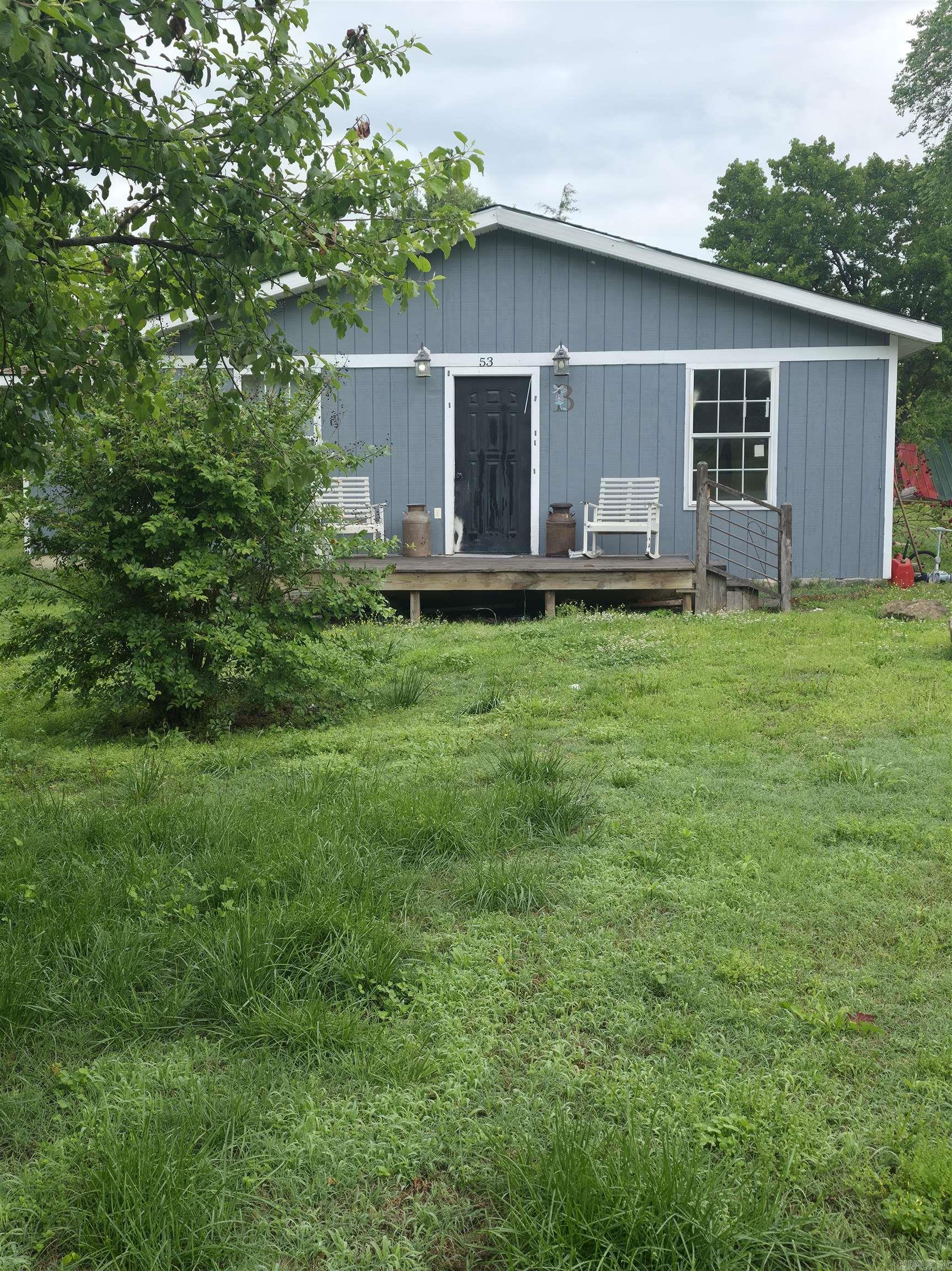 Welcome to the market this cozy 3 bedroom, 2 bath house sitting on 2.2 acres in Oxford, Arkansas!  This property provides multiple fruit trees and ample room for a garden. This house provides a spacious living room, dining room and outdoor pool area ready to entertain company no matter what the weather is!  You'll find new flooring and rustic barn tin throughout the majority of the home giving it a cozy country feel!  The very desired internet, NEXT powered by NAEC, is available at this location and Oxford city water/septic.  One of the two bathrooms is undergoing remodeling, also leaving room for a fourth bedroom.  This home is just minutes away from a local gas station, Dollar General, city park with walking trail, coffee shop, hair salon and the ICC Highschool.  The roof was replaced in 2018.  Since 2019 this property has received new floor joists in the home, storage shed and pool deck with electricity, and a RV hookup.  More recently a window heat unit and new water heater were placed in the house.
