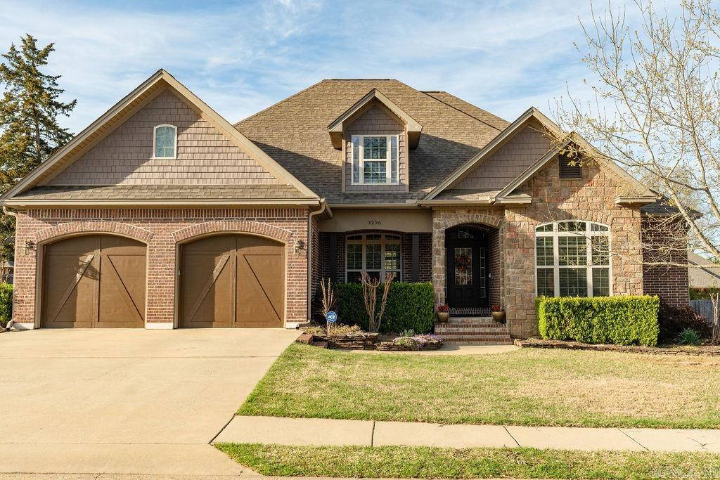 Experience the elegance of this lovely transitional European-style residence, offering 5 bedrooms and 3 baths, plus an extra office/craft room. This home is designed for comfortable family living with 4 spacious bedrooms downstairs, including an en suite bathroom. Equipped with a gas range, convection oven,  built-in microwave, pot filler, pantry, separate dining area and a cozy breakfast nook, this kitchen is the heart of the home! Featuring crown molding, tall ceilings, and a gas log fireplace, the living area is both welcoming and functional. Hand scraped hardwood and natural tile flooring flow seamlessly throughout the first floor. A private 5th bedroom featuring a walk-in closet is upstairs. Office/Craft Room: This flexible space is perfect for productivity or creativity. Walk-in Storage: Conveniently located for additional storage needs. Upgrades: Ground Zero in-ground tornado shelter in the garage, tankless gas water heater (replaced in 2020). Upstairs HVAC system and control board (replaced in 2020). - Downstairs heat pump (replaced in 2020). Sealed crawl space and insulated garage doors contribute to the home’s energy efficiency. This home is ready for your family.