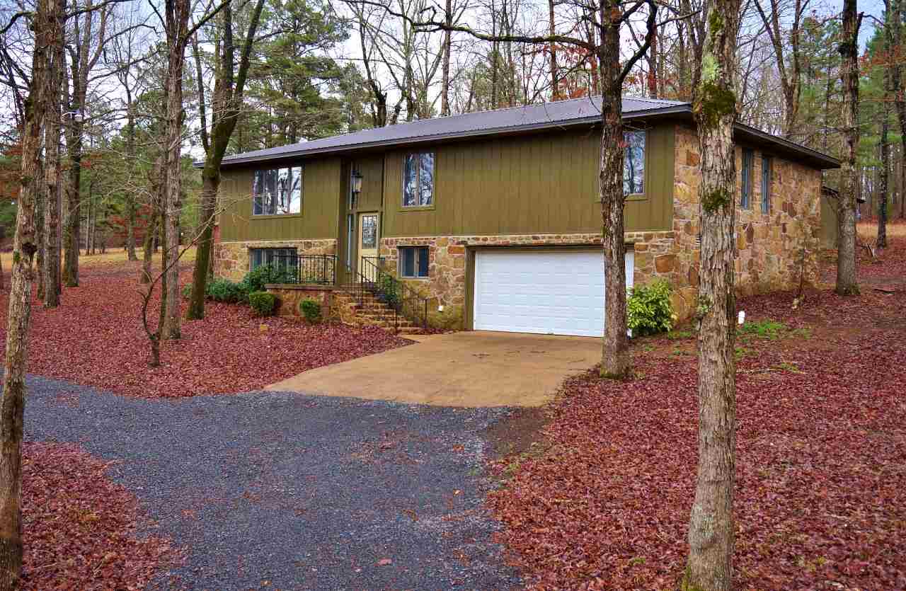 Beautiful 4BR, 3BA home blends perfectly with the surroundings. This secluded retreat is surrounded by 20 acres of woods, with a few clearings that would be perfect for a horse. The home is just minutes from Greers Ferry Lake and Quitman, but it will make you feel miles and miles away from the hustle and bustle. Large shop and small barn on property. Oversized garage and huge bonus room downstairs. New heat/air, roof, flooring, kitchen appliances, water heater, interior paint, etc! Great place to call home!