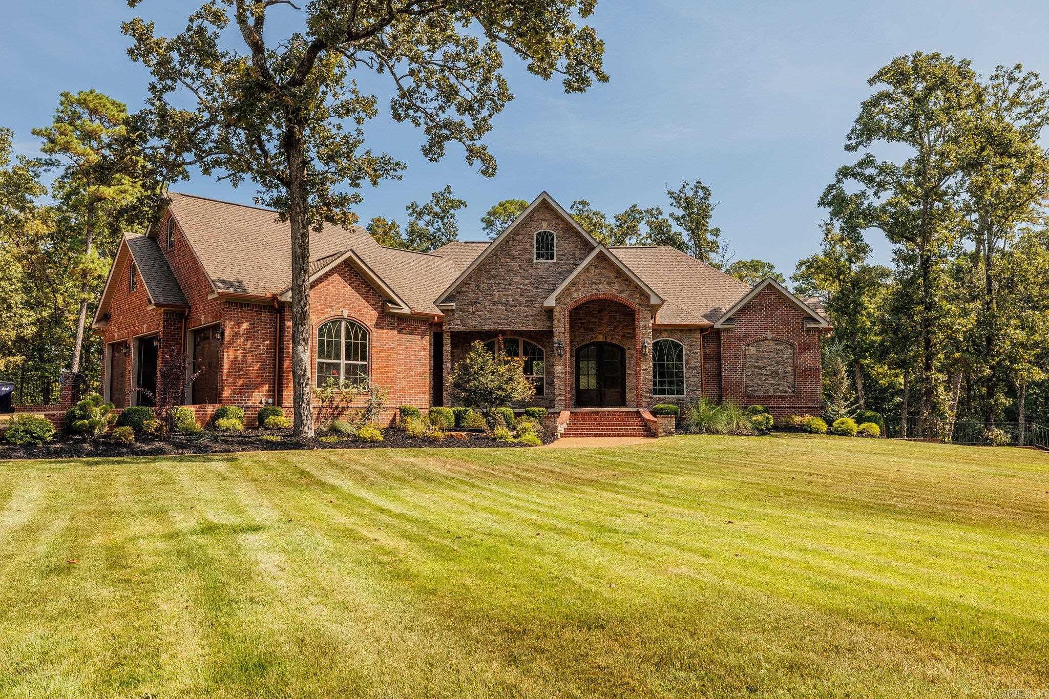 THE EXCEPTION TO THE USUAL! If you want PRIVACY but also the CONVENIENCE of being in a neighborhood, this HOUSE IS FOR YOU!! DRESSED FOR SUCCESS, 1155 Mountain Ridge Rd is BEAUTIFULLY situated down a long private driveway on 20.81 wooded ACRES in the Mountain Ridge sub-division on The Course at Eagle Mountain. Entertaining will part of the REAL JOY in owning this 4-bedroom, 3.50-bathroom home with over 5600 SQUARE FEET! Picturesque entry graciously opens to your centrally located family room and formal dining. The floor to ceiling rock fireplace, custom built-ins, wood vaulted ceiling and wall of glass windows will provide a relaxing environment to go away without getting away. This DECORATER-built kitchen with a pantry offers TOP NOTCH appliances & storage for all of your cooking needs! RELAX in the MORNING ROOM off the kitchen in between preparing meals. PRIMARY BEDROOM with in-suite bath/dressing area is enhanced with heated tile floors, double vanities, a SPACIOUS walk-in shower AND walk-in closet. Main floor also includes 2 additional bedrooms, another full bath, half bath and OFFICE! ENTERTAINING sized RECREATION area in the basement will be the FUN CENTER for you and your g