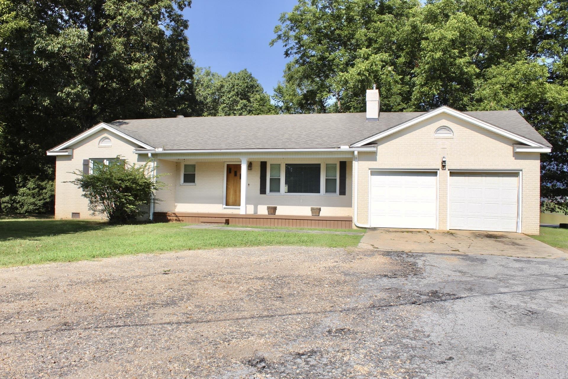 Welcome home to this beautifully updated 2 bedroom, 2 bath home situated on a spacious 0.56 acre lot with mature shade trees and a huge backyard that's perfect for relaxing, entertaining, or enjoying the outdoors. Inside, you'll find oversized bedrooms with walk-in closets, updated finishes throughout, and a cozy living area featuring gas log fireplace for added comfort. The kitchen comes complete with the refrigerator, stove, and dishwasher, making this home truly move in ready. Additional peace of mind comes with a roof replaced approximately in 2020–2021. Whether you're a first time homebuyer, looking to downsize, or simply searching for a very well maintained home with plenty of outdoor space, this property checks all the boxes. Don't miss your chance to make this one yours!