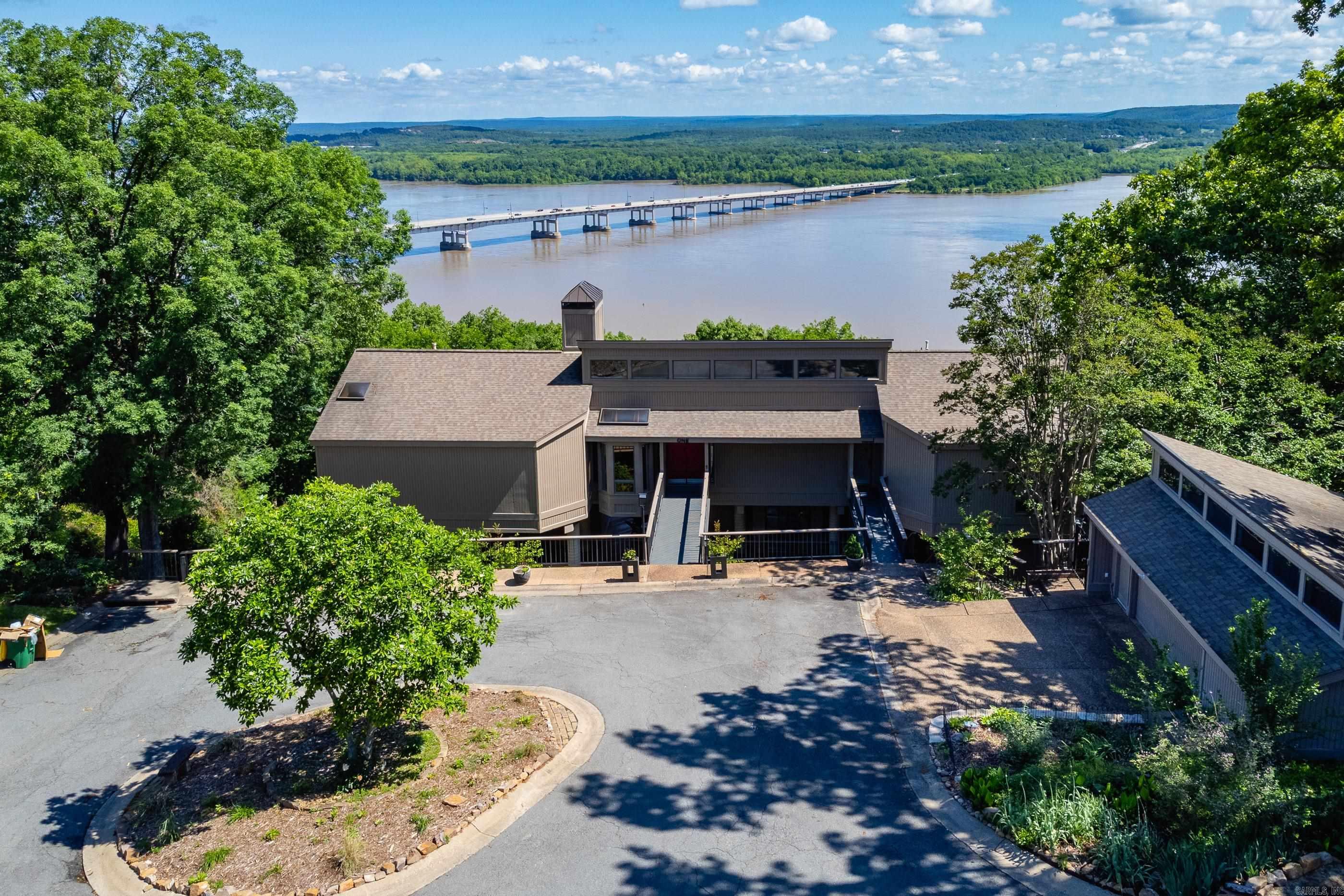 Luxury River View Retreat in River Ridge! Discover your dream home nestled on 6.85 serene acres with breathtaking river views. This stunning property offers a perfect blend of elegance, comfort & outdoor living. Key features include a spacious primary suite and guest suite on the main level, private mother-in-law or guest suite with its own exterior entrance, complete with kitchenette and full bath. 14 x 48 (4.5' deep) lap pool with new decking, perfect for relaxing and entertaining. Elevator servicing all three levels for convenience and accessibility. Two car detached garage. Custom wood and steel decking on two levels. Whether you're seeking a peaceful retreat or a place to host friends and family, this exceptional property offers it all. Don't miss out on this unique opportunity-schedule your private tour today! Home built by Jack Hartsell. Third bedroom is in the apartment. NEW CARPET in bedrooms and apartment. See Showing Remarks, Agent Remarks and Attached Documents for more information regarding this unique property.