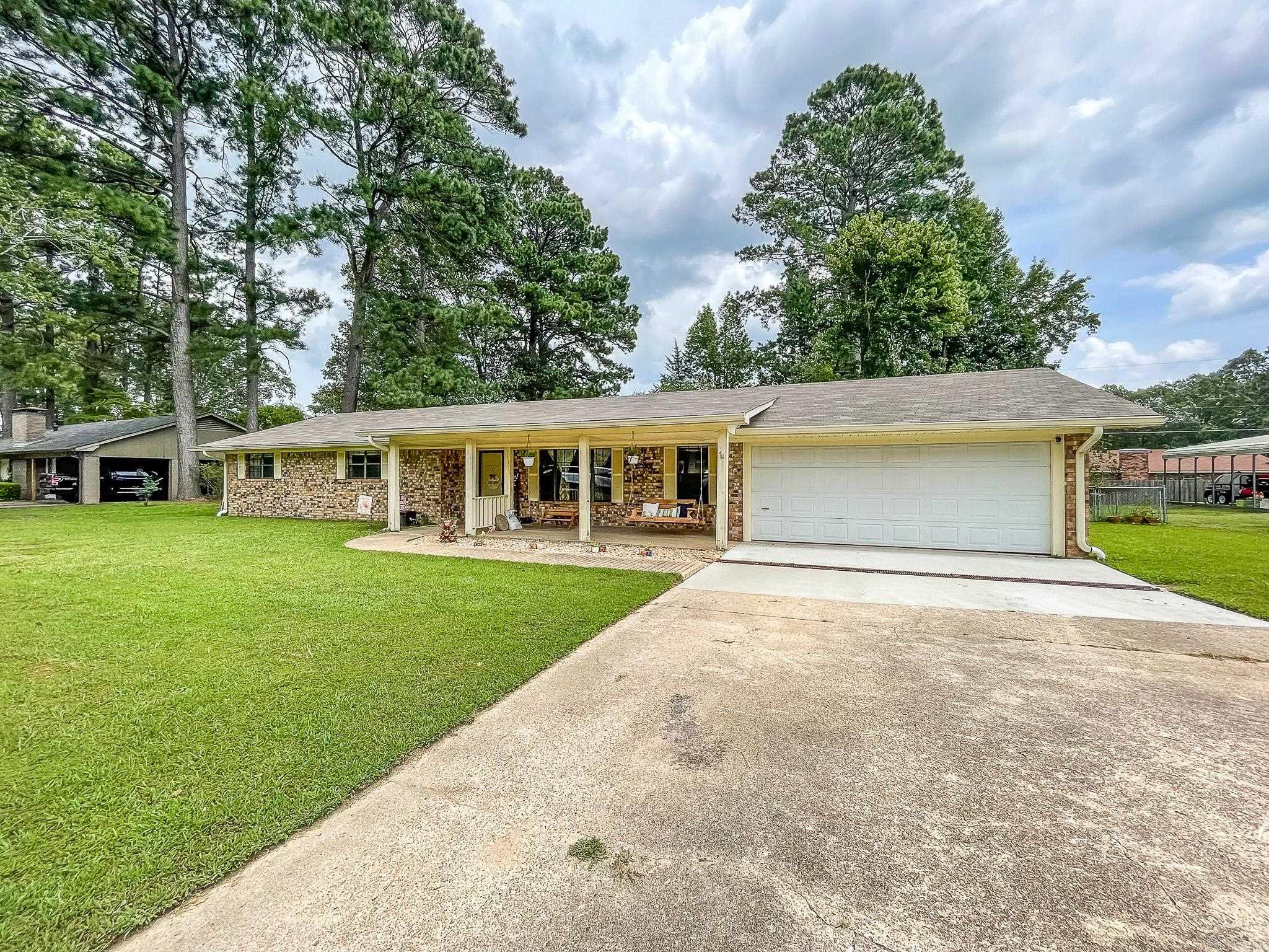 Located in the sought-after Cherokee Subdivision, this charming home is move-in ready!   New roof and stainless steel kitchen appliances, granite, and modern backsplash in 2020, new gutters in 2021, vinyl flooring in the main areas, and French drain system. New paint throughout for a refreshed feel   You'll love the open living room & dining area with easy access to the covered back patio, anchored by a cozy brick fireplace. The primary bedroom offers two closets and a spacious bathroom with walk-in tiled shower. Don't miss the large laundry room with extra shelving area.   The fully-fenced backyard also features a storm shelter and storage shed.   There are so many things to love about this welcoming home, and it might just be the one you fall in love with and call home!   *Square footage from appraiser's report; tax amounts and lot size taken from courthouse records*