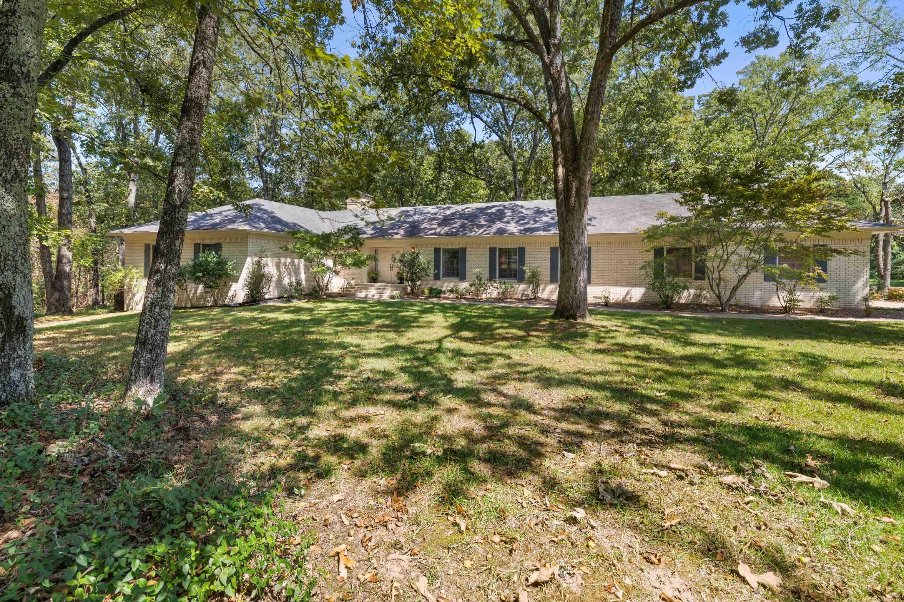 PRICE IMPROVEMENT!  Nestled on nearly 3 private acres w/ mature trees & a peaceful setting, this stunning designer home offers over 3,700 square feet of comfortable living space. Step inside to find 2 expansive living areas, a formal dining room,  and cozy breakfast room. Two fireplaces add warmth & charm throughout the home. This thoughtfully designed residence features 3 master-sized bedrooms all w/ walk in closets, each with its own private en-suite bathroom. A half bath serves the main living areas. On the lower level, you'll find a private bedroom/living area, walk in cedar closet, a full bath plus a secure, built-in safe room for peace of mind. Whether you're hosting a holiday dinner or enjoying a quiet evening by the fire you'll appreciate the space and flexibility this home provides. The open 2-car carport along w/ the expansive wood deck adds practicality, while the lush, wooded surroundings offer unmatched privacy & seclusion, all within minutes of everything Heber Springs has to offer. Don't miss your chance to own this rare blend of seclusion, space, & sophistication in one of Heber Springs' most desirable locations.