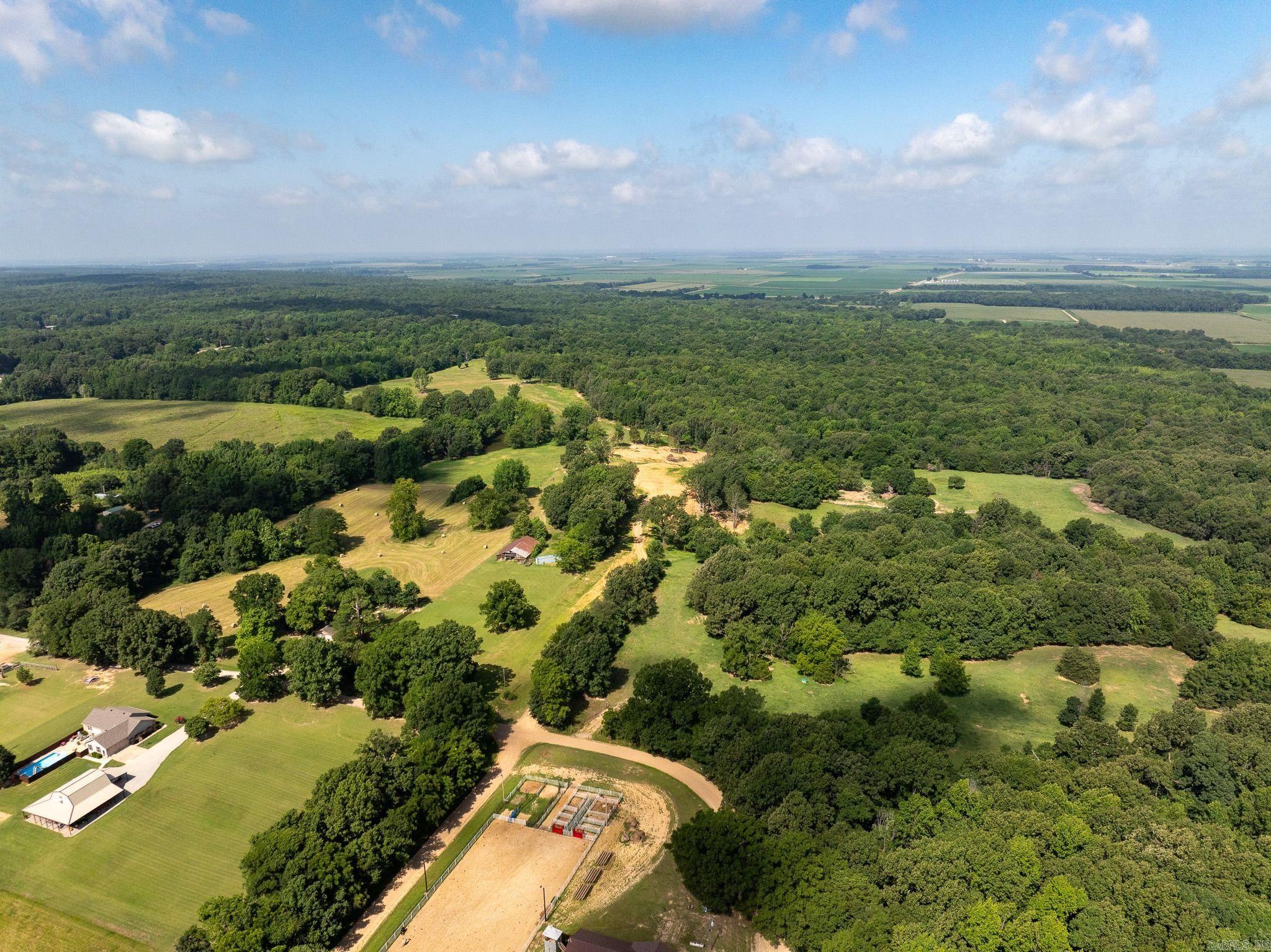 Welcome to Lorado Sporting Estate, a versatile Northeast Arkansas property offering an excellent combination of country living, recreation, and opportunity. Whether you're looking to build your forever home, start a hobby farm, raise livestock, or own your own hunting property, this tract offers endless possibilities.  A beautiful mix of open pasture and mature timber creates both functionality and character. Established interior roads provide easy access throughout the property, while a pond offers a reliable water source and adds to the recreational appeal.  Water and electric are available, making this an ideal setting for a custom home overlooking the rolling landscape. The open ground provides space for livestock, horses, gardens, and hobby farming pursuits, while the timber offers privacy and quality wildlife habitat.  The property features a proven hunting history with abundant deer, turkey, and small game frequenting the area year after year. Opportunities to own a property that combines homesite potential, recreation, and agricultural versatility are becoming increasingly rare.  Additional acreage may be available.