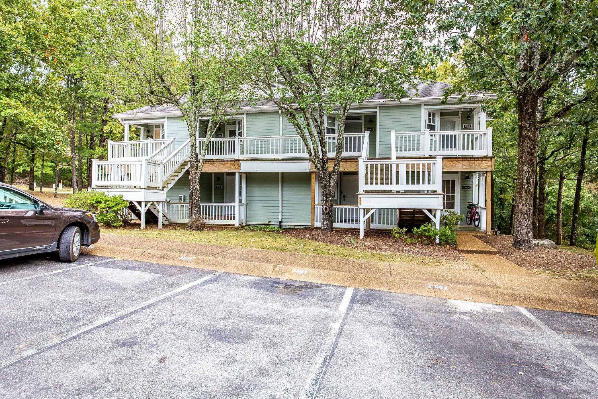 Experience the ultimate in serene living with this exquisite Summer Hill Place condo, perfectly nestled amidst the lush canopy of the Ozark Mountains. This recently updated studio offers a seamless blend of modern elegance and nature’s tranquility. Step inside to discover a beautifully refreshed interior, boasting new floors and a fresh coat of paint, complemented by stylish furnishings that invite you to settle in immediately. Designed with efficiency and comfort in mind, the studio features a cozy sleeping area, a sleek bathroom with a rejuvenating shower, and a well-appointed kitchenette that makes meal preparation a pleasure. A stackable  washer and dryer provide added convenience for everyday living. For moments of relaxation, step out onto your private back deck and lose yourself in the serene views of the surrounding woods. Enhance your lifestyle with access to an array of resort-style amenities right at your doorstep. Dive into any of the three sparkling pools, perfect your swing at the two beautifully maintained golf courses, or explore the pristine waters of nearby Greers Ferry Lake. Plus, enjoy all the vibrant recreational and cultural offerings of Fairfield Bay.