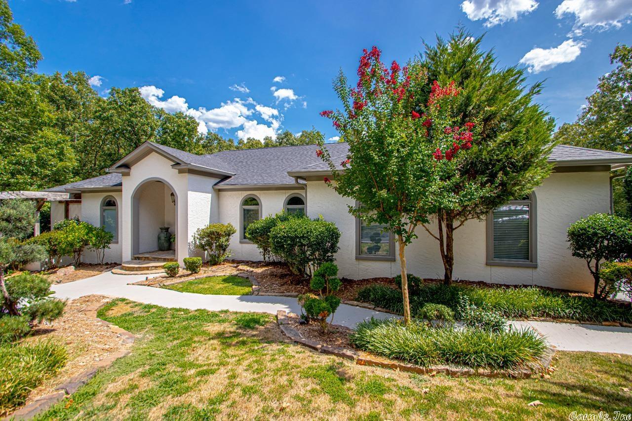 You will love this completely remodeled gorgeous home that sits on 5 acres. This property is super private and sits back off of the main road down a private drive. It features a new kitchen with all new appliances, new roof, 2 new HVAC units, new tankless water heater, new light fixtures, surround sound, new hardwood floors & interior & exterior paint throughout.  The heated pool and hot tub oasis are to die for-  There is also a basketball court, and a circle drive.  This home is only 10 minutes to I-430.