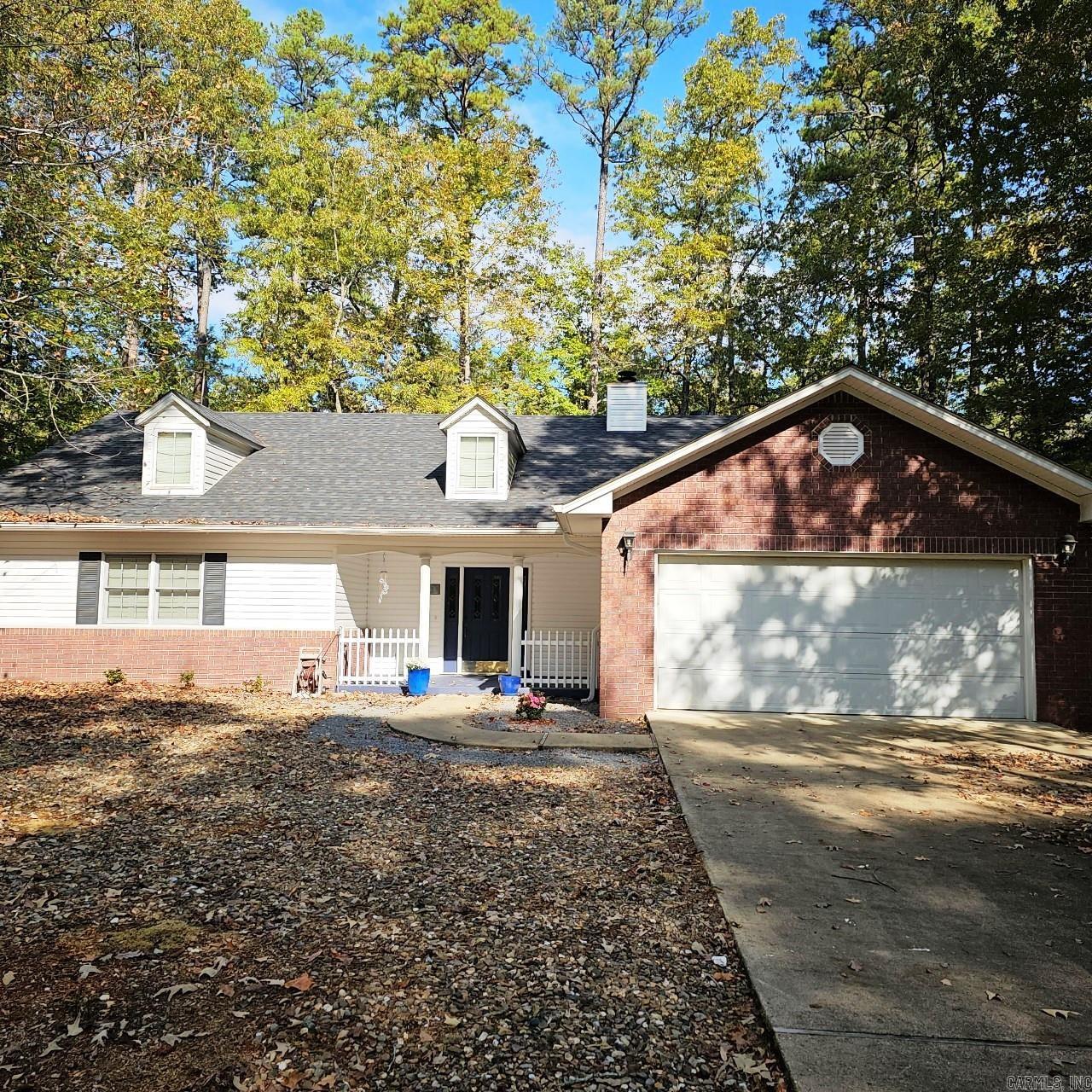 Open floor plan with a level lot, 2 nice size bedrooms, Arkansas Room could be 3rd bdrm if needed, mostly wood and tile, carpet in bedrooms only 1 year old, 2 1/2 baths, fireplace,2 car garage, large laundry room with nice storage. Large kitchen, center island, loads of cabinet space, smooth top range and stainless steel refrigerator. Dining and living area combined. Bedrooms designed for privacy for guest. Large walk in closet in Master, walk in large shower, double lavatory. Huge fenced in yard for your fur baby. Vinyl and Brick exterior, maintenance free landscaping. $269,000 Built in 1996 with approx. 1962 sq. ft of h/c space.
