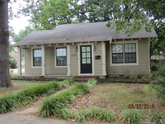 Heights neighborhood, corner of N. Polk and Cantrell, fenced backyard, CH,CA, separate dining room and hardwood floors.  White picket fence.