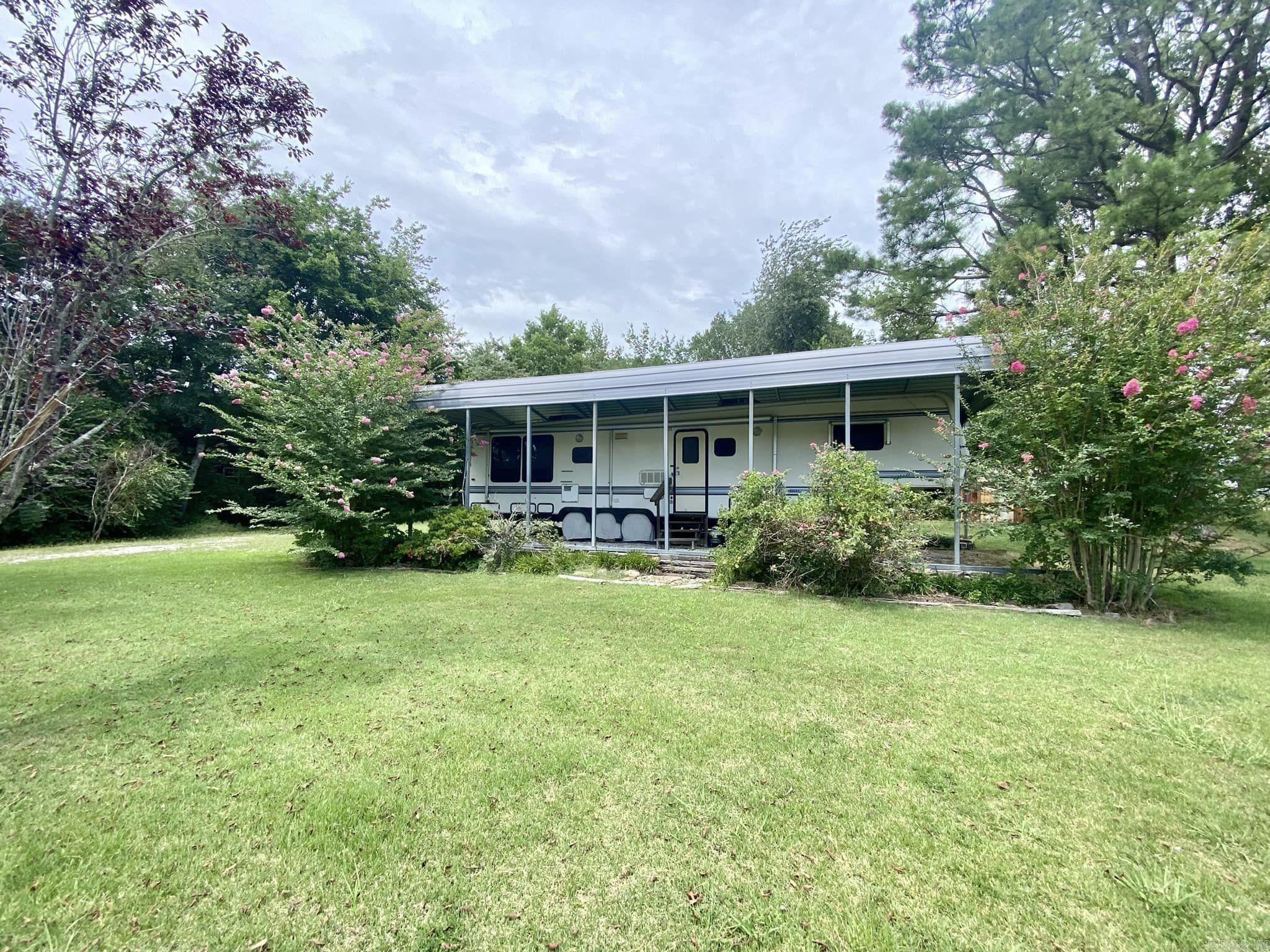 1/2 acre corner lot with a beautiful view of the mountains. Property has an RV and RV Cover that will convey with the land