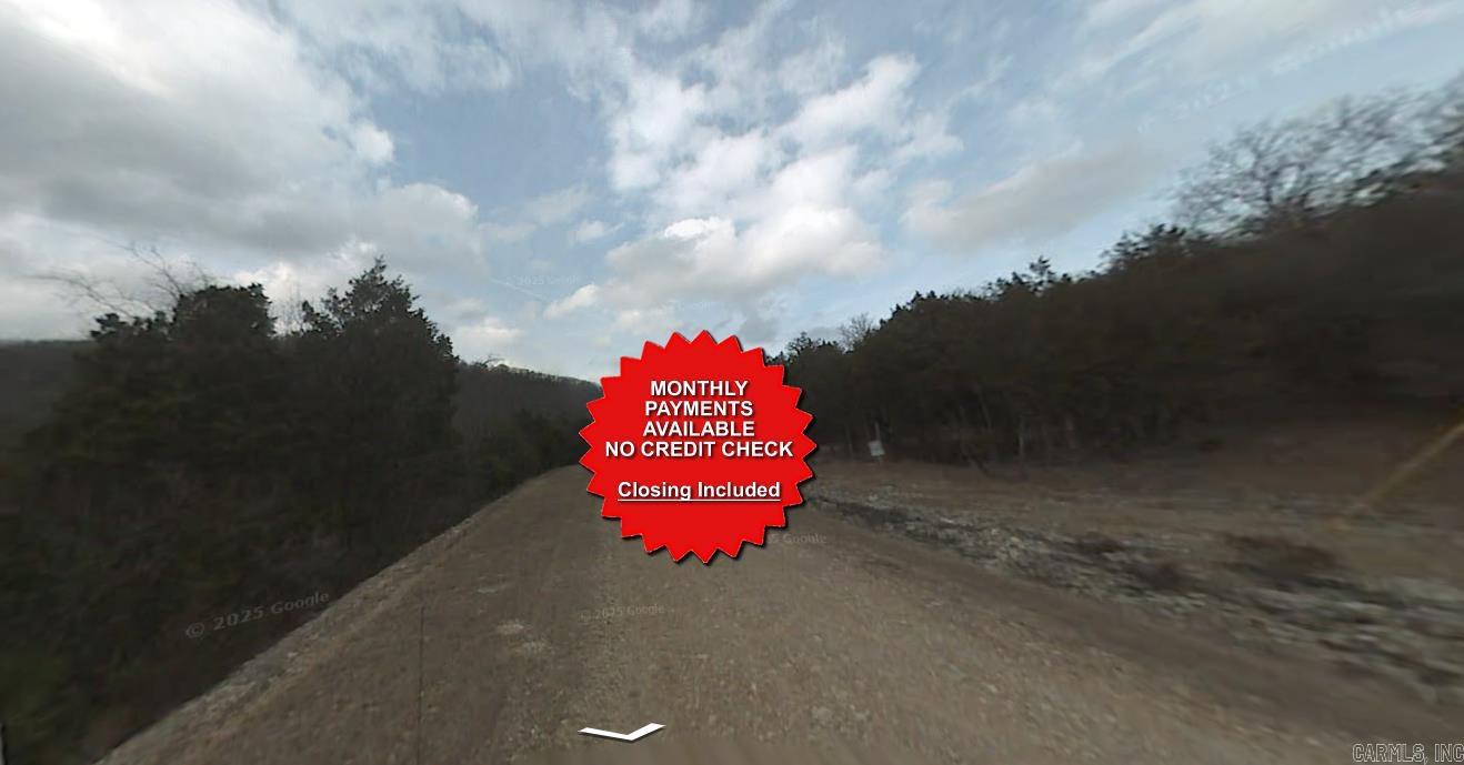 County appraised value $7500. Owner-finance available for easy terms. You cannot camp or park a trailer on the lot. No mobile homes but other types of housing is allowed. Not far from Eureka Springs, the Missouri and Oklahoma border and very scenic mountain area. Public sewer and water at the paved road and electric not far. Nice lot to develop or hold for future value. Owner/agent. Finance is $250 down and $295 a month for 10 months. Quit claim deed conveys. Closing costs are included. Bulk land sales specialist with the best land prices in Arkansas. Over 10 years, as a licensed Realtor, selling land.  Parcel ID# 320-03591-000