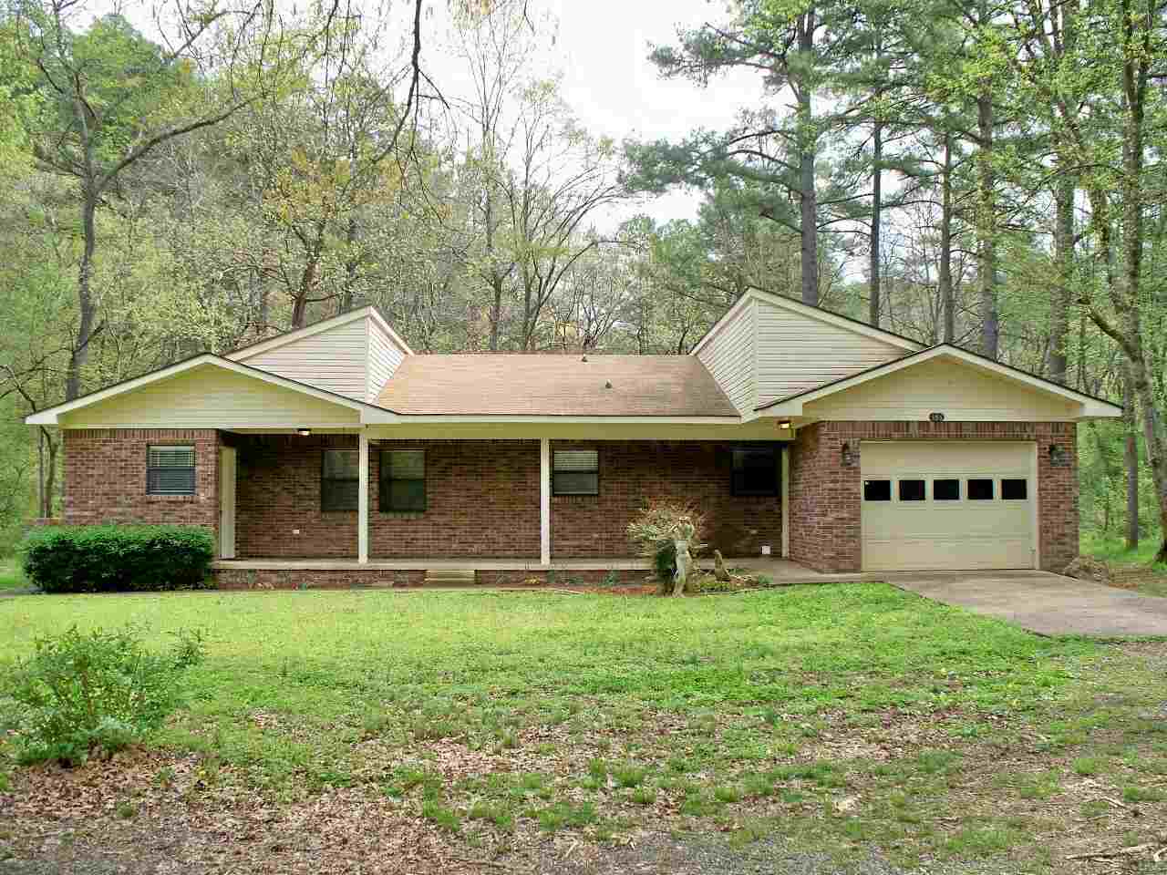 Three bedroom two and a half bath home in Lakeside school district situated on 2 acres with creek, screened porch, large bedrooms and garage.
