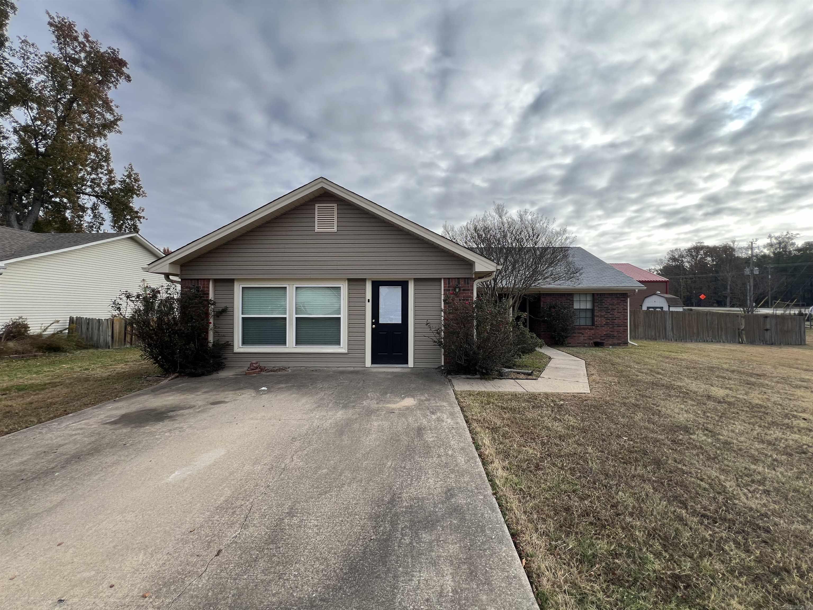 Walk to Elementary school! This lovely 3 bedroom home is very well maintained and looks the part! Relaxing large living area with fireplace. A true cook's kitchen with lots of storage, island and stainless steel appliances. Off the kitchen are built-ins with office area. Master has his and her closets with a master bath with jetted tub and walk in shower. Home also offers a enclosed garage that could be used as a playroom or mancave! A perfect home for you!