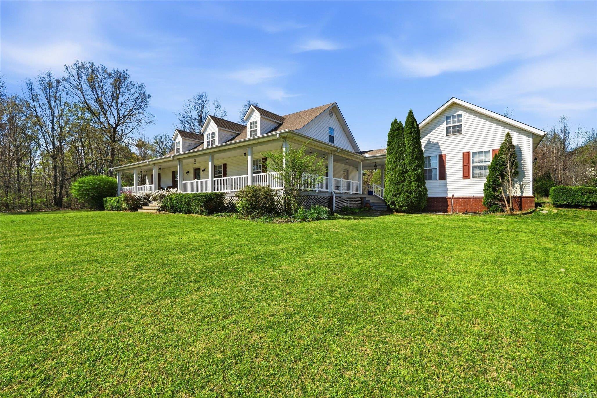BEAUTIFUL LOCATION & HOME w/City Utilities. Sitting on 7.3 acres mostly in city limits. Barn & fenced for small animals. Very Lg Shop w/Overhead door. (Shop & Barn have electricity.) Home features 3 BR/2.5 BA. Hidden upstairs is an attic w/stairway that could easily be finished into Lg. bonus room or extra BR w/electricity & plumbing. Also stairway in 2 Car garage to a fully floored attic w/ electricity that could easily be finished into office or extra room. Roof 6 yrs old. SO MUCH MORE!!