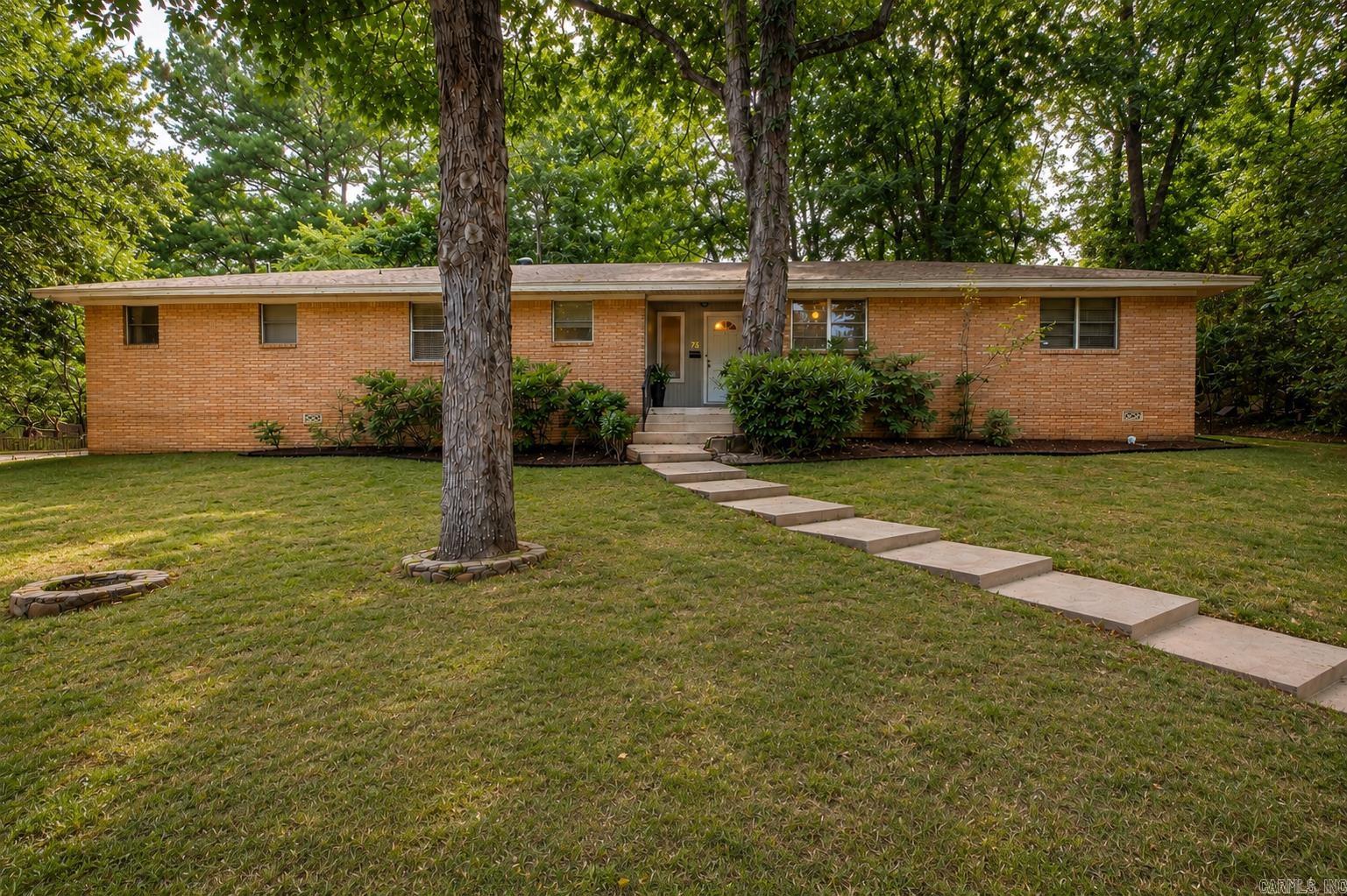 Looking for a home with incredible potential in one of Little Rock's most desirable neighborhoods? Welcome to this well-built home in Kingwood! From the moment you arrive, you'll love the curb appeal, spacious lot, and private setting. Inside, you'll find a great floor plan, real hardwood floors, and the perfect opportunity to update the home to fit your own style. Step outside to enjoy the newer deck, newer wood privacy fence, and a backyard that's perfect for relaxing or entertaining. Covered parking adds even more convenience. A new roof was completed in  2024, giving you peace of mind while you make this home your own. If you've been searching for a solid home with character, privacy, and endless possibilities in an outstanding location, this Kingwood gem is one you won't want to miss.