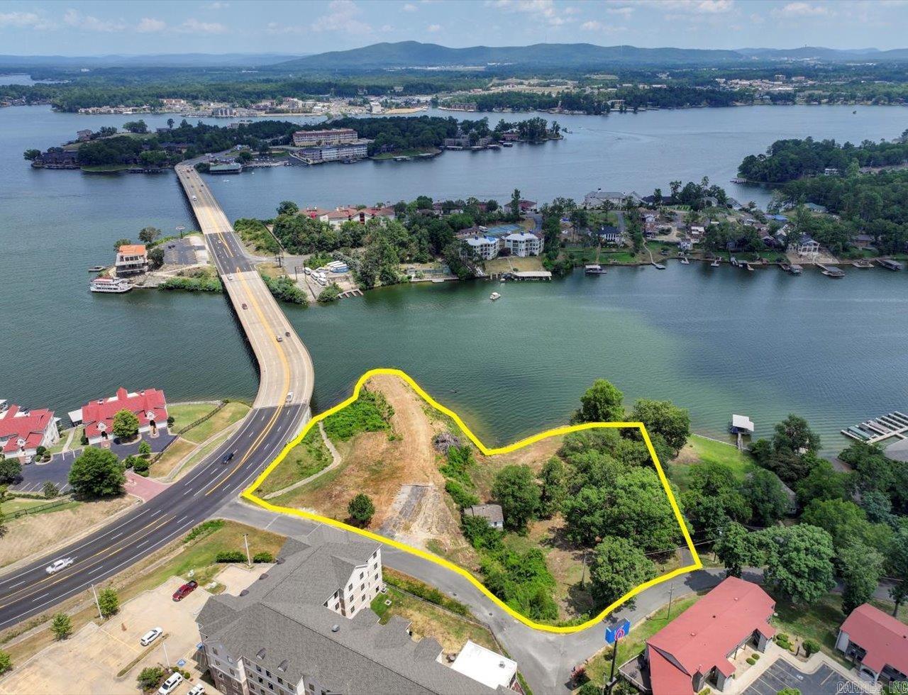 PRIME LAKE HAMILTON LAND READY FOR DEVELOPMENT! 2.59 Acres with 592' of frontage on Lake Hamilton.  Perfect Site for Multifamily, a Hotel, a Restaurant, Residential, you name it! Very Unique Property with few like it available to develop on Lake Hamilton.  Phenomenal Views from the Point of the Property.