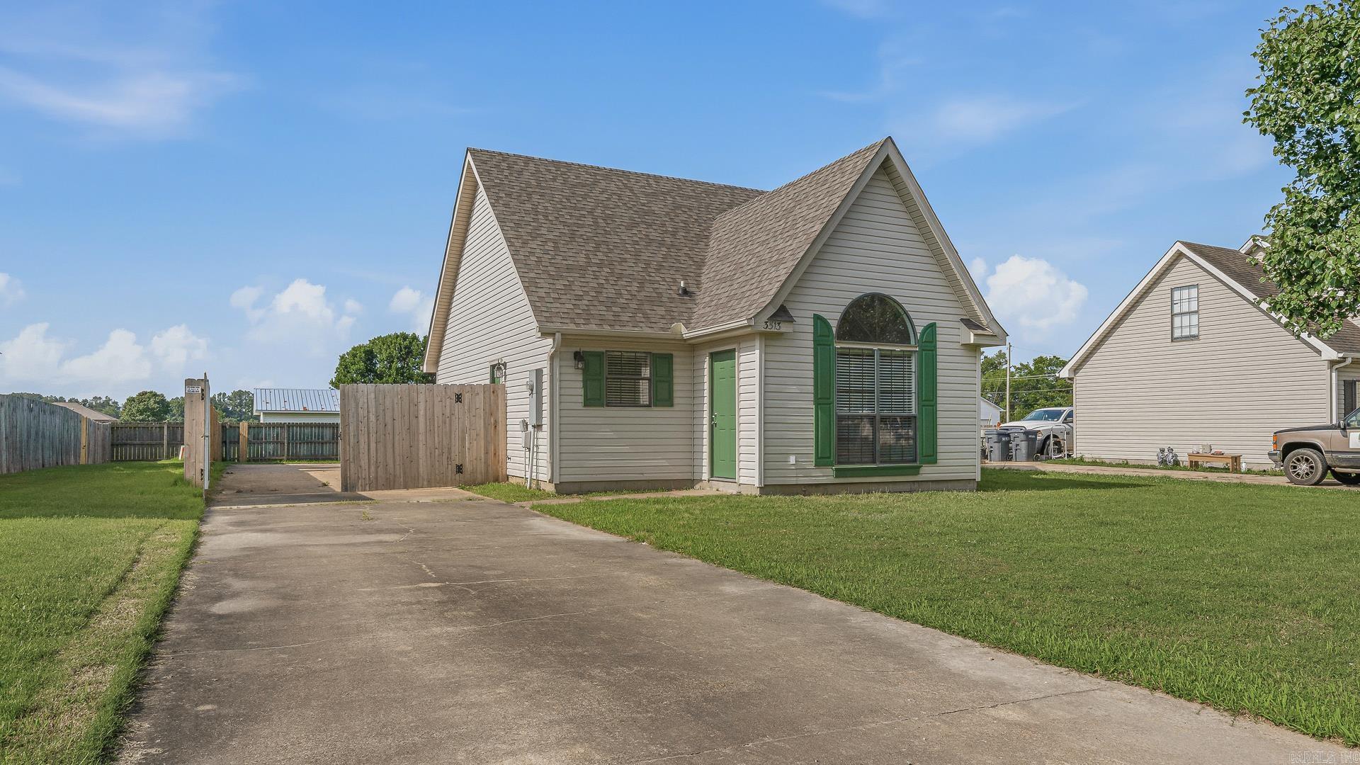 Welcome home to this beautifully updated 2-bedroom, 1-bath cottage in the highly sought-after Nettleton School District! Blending classic charm with modern updates, this move-in-ready home features stylish luxury vinyl plank flooring, shutters, and a durable architectural shingle roof for added peace of mind. The bright and inviting interior offers comfortable living spaces designed for everyday living and effortless entertaining. Outside, you'll find a spacious privacy-fenced backyard perfect for gatherings, pets, gardening, or simply relaxing in your own private retreat. A convenient parking pad adds functionality and curb appeal. Whether you're a first-time homebuyer, downsizing, or searching for a turnkey investment property, this charming cottage is a must-see. Schedule your showing today!