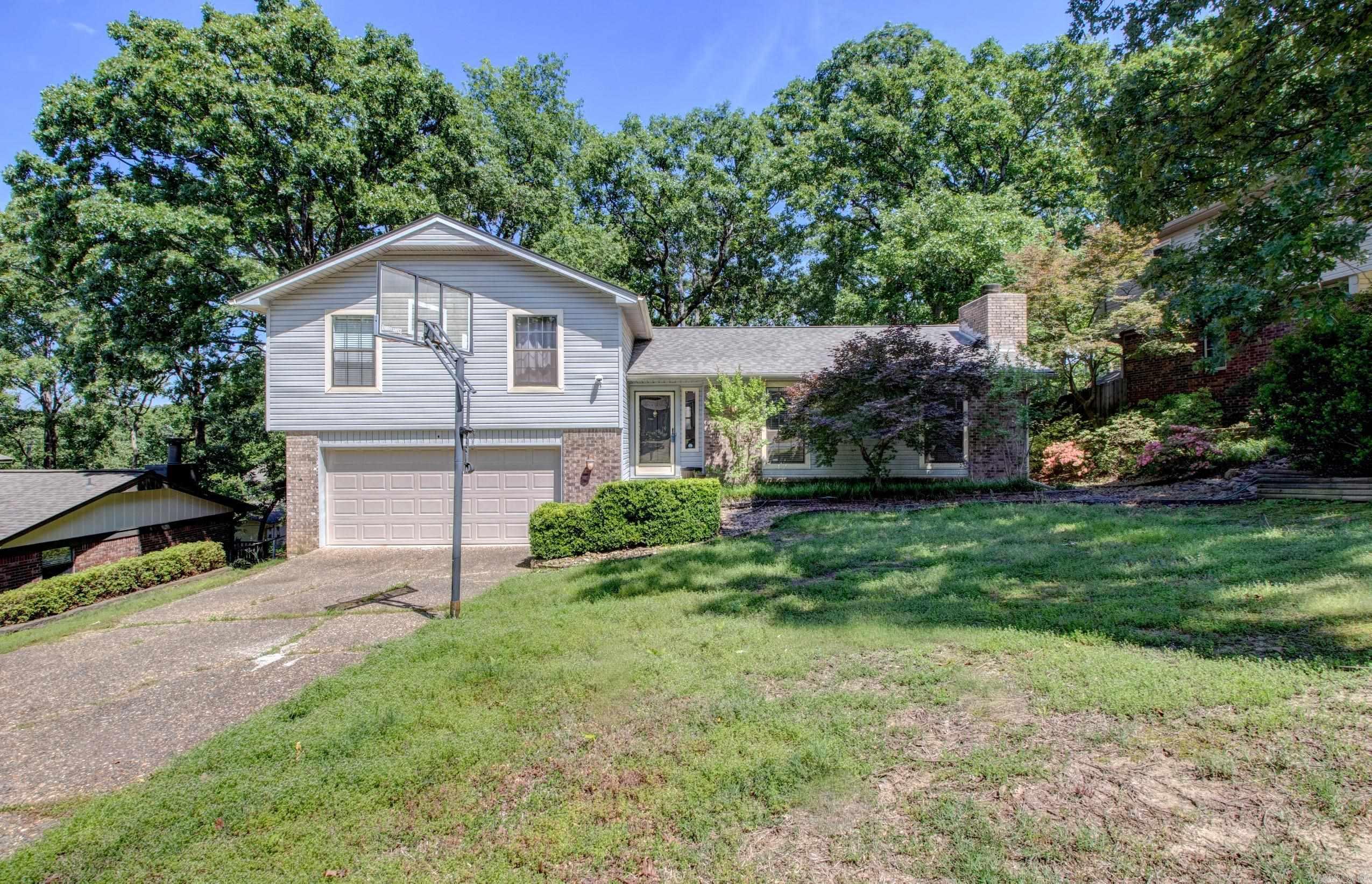Fantastic home with updated kitchen with quartz countertops and soft close cabinet doors. New Deck 2026. Main level HVAC replaced Dec 25. New Roof 2023. Large living room with vaulted ceiling and wood burning fireplace with gas starter. Kitchen has dining area and a formal dining room or use as an office. Large master bedroom with 2 closets. Additional heated and cooled shop or craft room. Additional storage building in backyard.