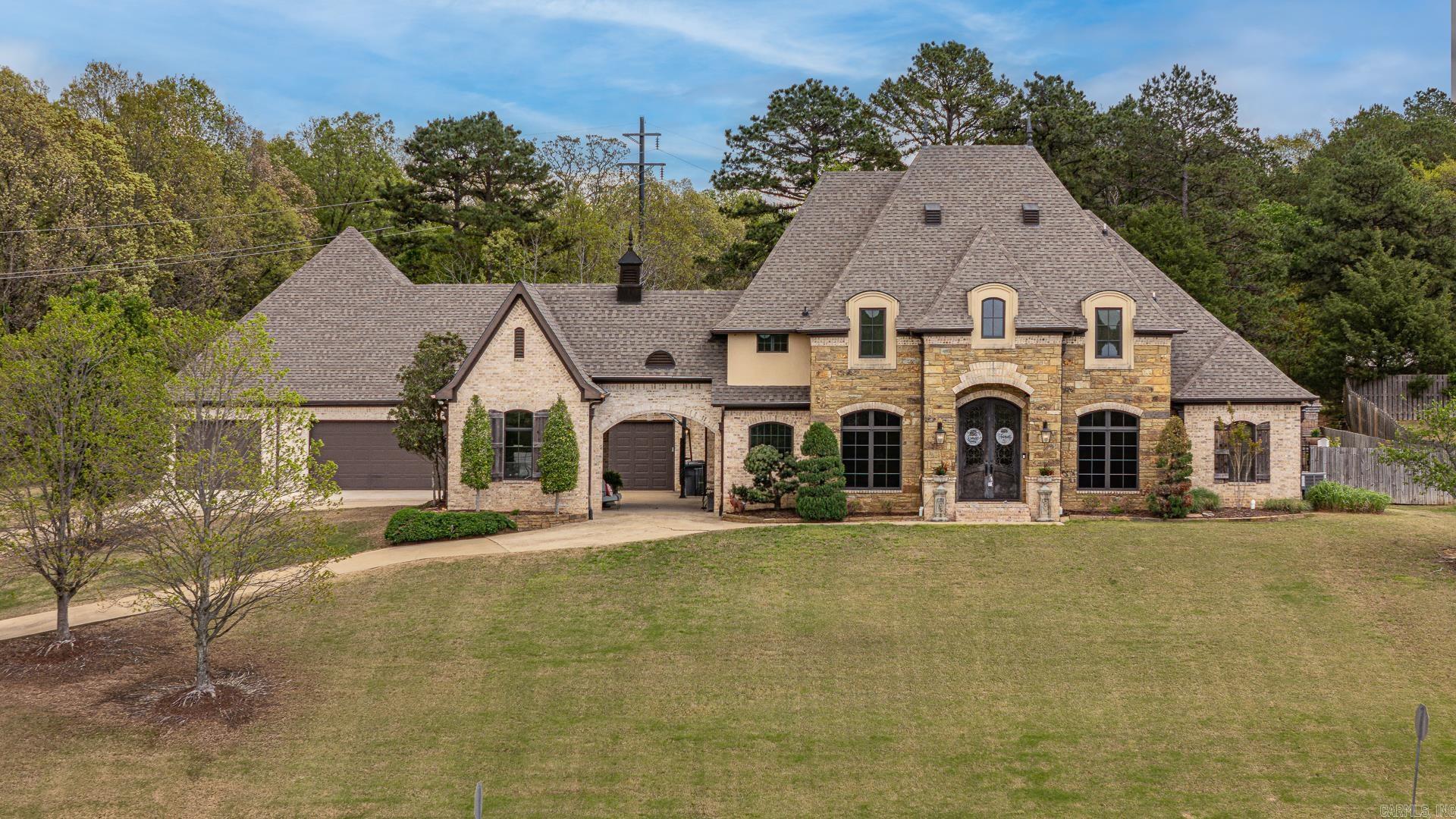 Welcome to luxury living in the heart of Dunwoody Estates in Jonesboro. This stunning 3-story estate offers an abundance of space, comfort, and high-end featuresperfect for both entertaining and everyday living. With 6 spacious bedrooms and 7 bathrooms (5 full and 2 half), this home is designed to accommodate with ease. The main level features a bright and open living room, a cozy sunroom, and a gas log fireplace that adds warmth and charm. You'll also find a dedicated office and a workshop, offering plenty of flexibility for work or hobbies. The kitchen includes a breakfast bar, gas appliances, and flows seamlessly into the main living areasideal for hosting family and friends. Downstairs, enjoy your own private movie room, perfect for movie nights or game day. Step outside to your private backyard retreat, complete with a heated saltwater pool and hot tub, an outdoor kitchen and bar, and a screened porch. The backyard is fully fenced, creating a private, relaxing atmosphere on the nearly one-acre (.92) lot. With a 6-car garage, there's plenty of room for vehicles, storage, and more. This exceptional home offers space, privacy, and luxury in one of Jonesboro's most desirable neigh