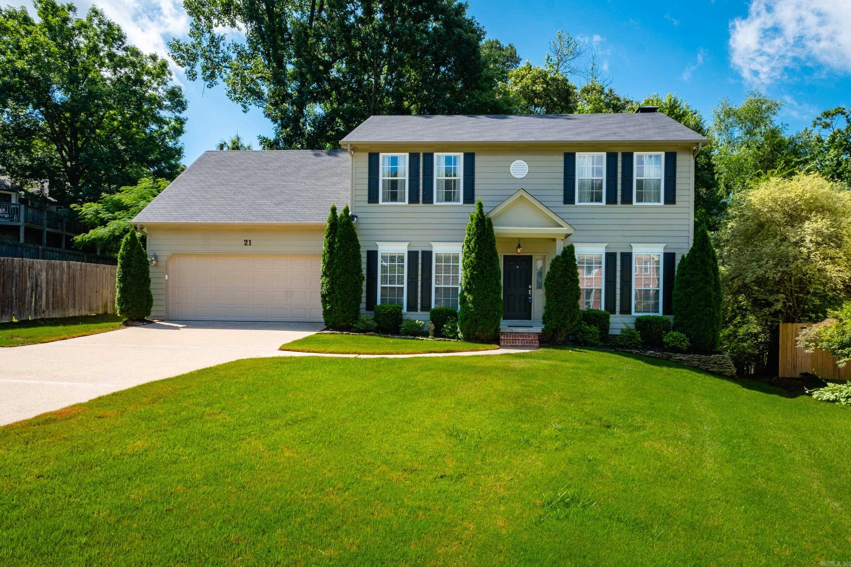 Situated on a lovely cul-de-sac, this well maintained 4 bedroom, 2 full and 1 half bath home offers a timeless floor plan with room to live, work, and entertain. Hardwood floors on the main level, where you’ll find a formal living room or private carpeted study, elegant formal dining room, spacious family room with fireplace and custom built-ins, and an inviting eat in kitchen featuring a center island with breakfast bar, cooktop, double ovens, pantry, abundant cabinetry, and generous workspace. Just off the kitchen are a convenient half bath and a large laundry room with additional storage. Upstairs, all four bedrooms are well proportioned, including a spacious primary suite with a large bath offering dual sink vanity, jetted tub, separate shower, and plenty of storage. Walk in attic access adds exceptional convenience. The screened covered deck creates a perfect outdoor living space, while the additional open deck overlooks the large backyard shaded by mature trees and bordered by a natural wooded backdrop. Attractive curb appeal, beautiful landscaping, and convenient to neighborhood amenities make this home one you will not want to miss. Come see!