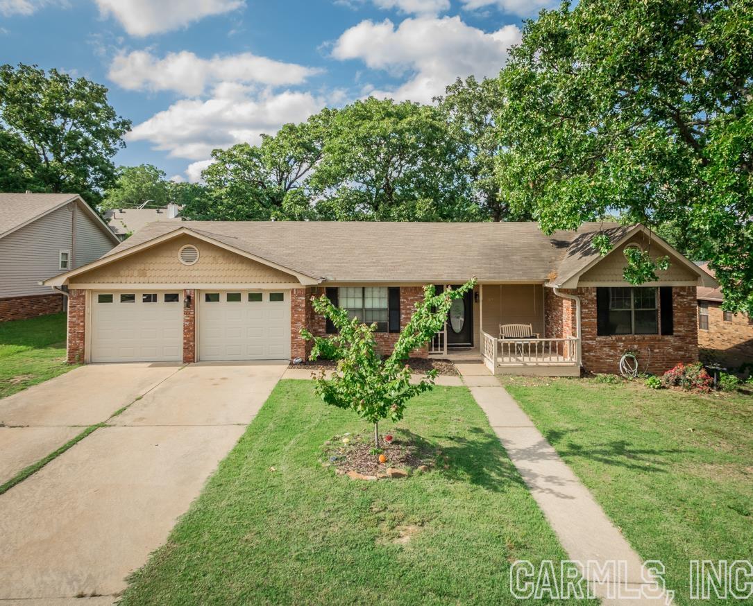 Do you want a house in a great neighborhood in Sherwood? This one is ready for you to move into! 3 bed/2 bath w/ a split floorplan. Vaulted ceiling in the LR w/ fireplace. New laminate flooring, New hot water heater & back fence. Amazing front porch & back deck areas. Fully fenced. New Refrigerator will convey.