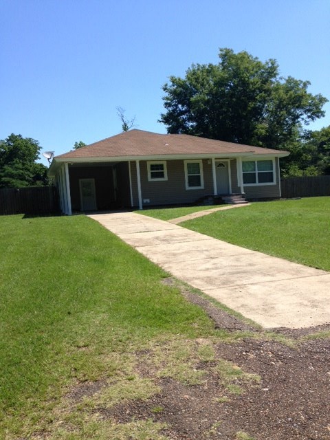 Completely updated home in the heart of town.  Offers 2 bedrooms, bonus office/bedroom and 1 full bath.  New vinyl siding and single carport with chain link/wood fenced yard.  This home has a large entertaining deck off the back of the home, with approx 1 acre lot, you are in town with privacy.  Kitchen is all electric, with new stainless steel appliances, new Ch/CA unit, updated tub/shower combo, floors are wood or tile.  All updates have been completed within the past two years. Great home, a must see!