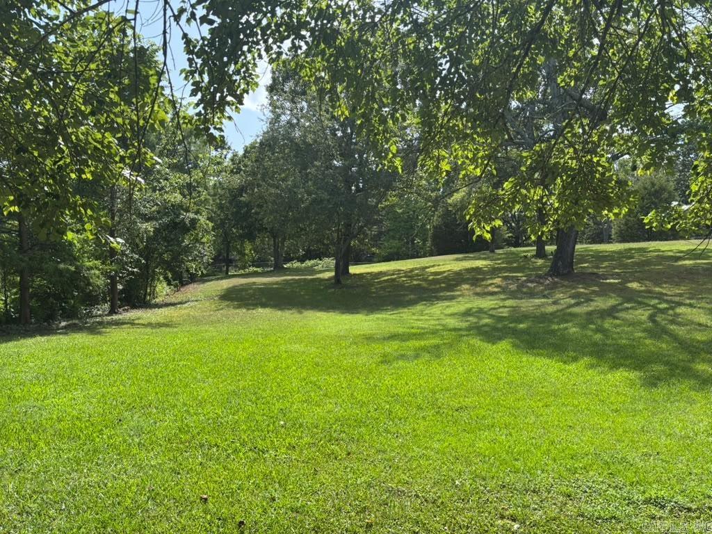 Rare Waterfront Opportunity: Ready-to-Build Parcels on Lake Conway! Fully fence, 2 Parcels (4 lots total) escape to the water and build your dream lifestyle on these exceptional lakeside parcels, situated in an established, peaceful pocket along Lakeshore Drive, this property offers the perfect canvas for your custom home, blending serene waterfront vibes with everyday city convenience. Stunning Lake Views: Wake up to sweeping vistas, incredible sunrises, and the peaceful rhythm of life on Lake Conway right outside your future front door.   Skip the massive expense and headache of land clearing. This lot is wide open, beautifully maintained, and virtually almost tree-free—meaning you can bring your builder and start breaking ground immediately. A massive bonus for any builder or investor! City utility services are already available at the property, saving you thousands of dollars in development costs and months of logistical delays. Plenty of space for outdoor entertaining or a private boat dock. While it feels like a quiet lakeside retreat, you are just minutes from I-40, local shopping, dining, and downtown Conway.  schedule your walkthrough today and start planning your view!